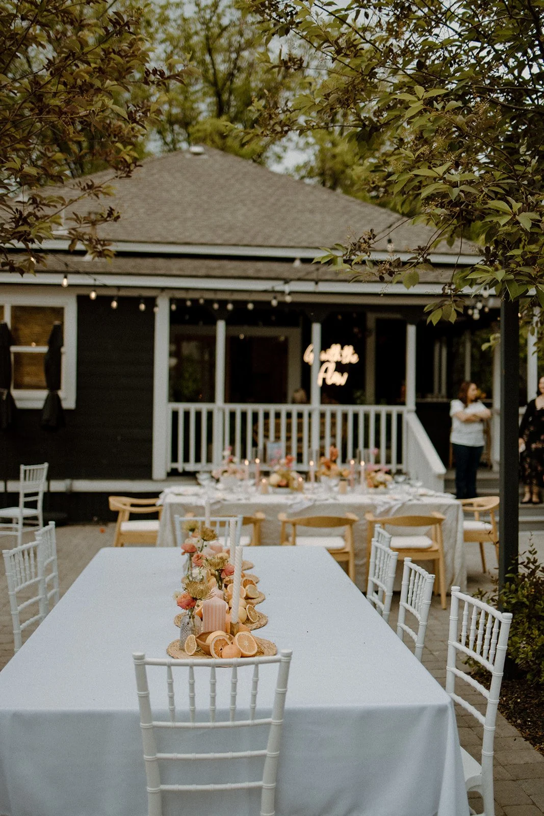 Tables being set for an outdoor event.