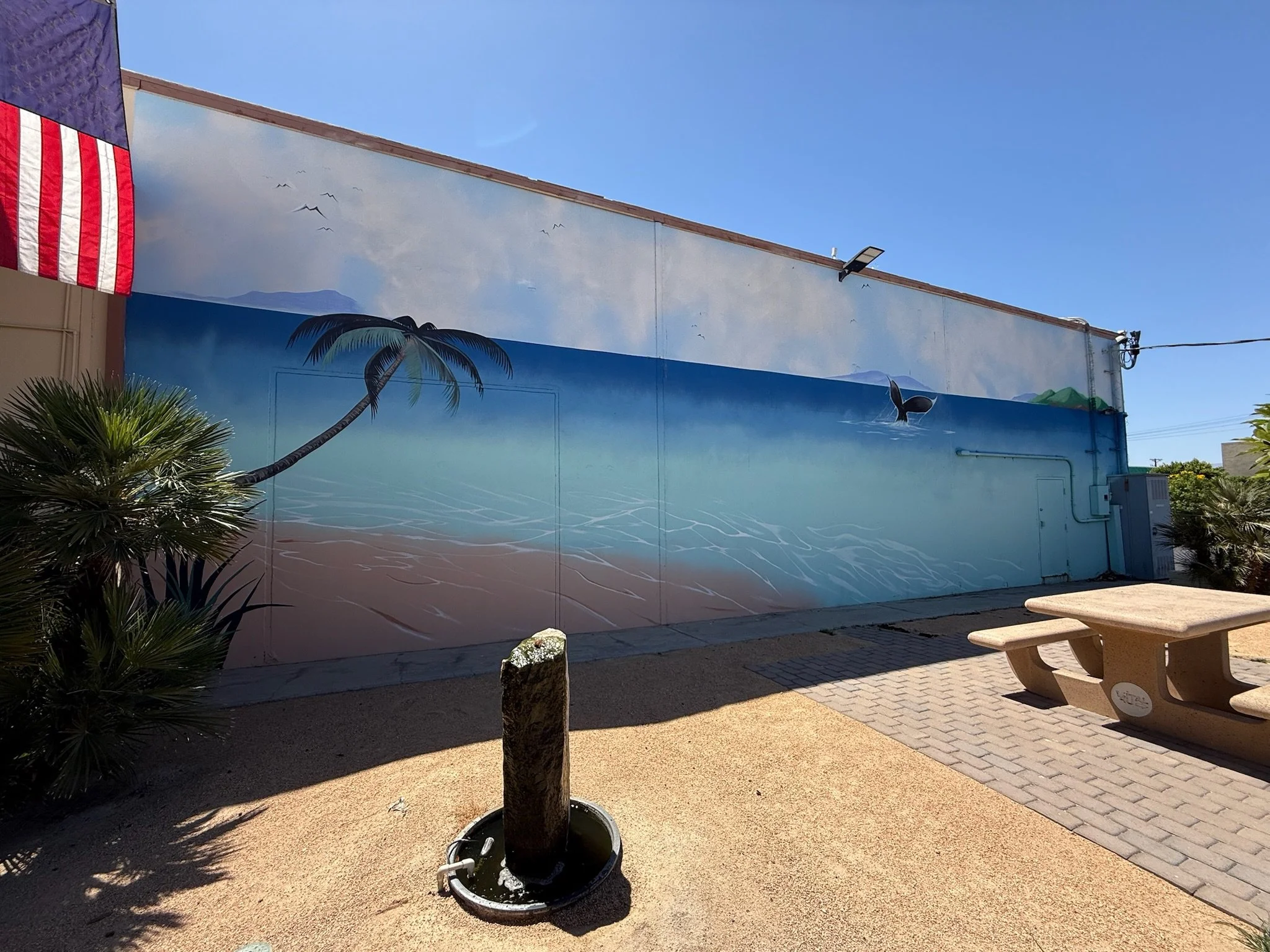 Hand-painted tropical beach mural for an outdoor patio in Southern California by SoCal Murals
