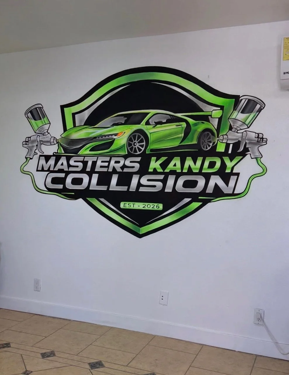 Hand-painted custom logo mural and branded wall for Masters Kandy Collision in Southern California by SoCal Murals