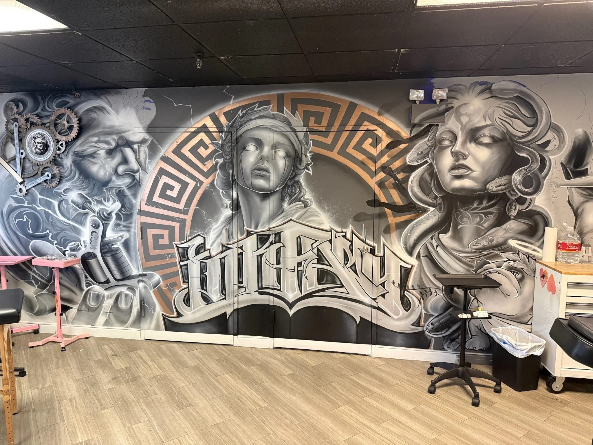 Custom hand-painted tattoo studio mural by SoCal Murals in Southern California