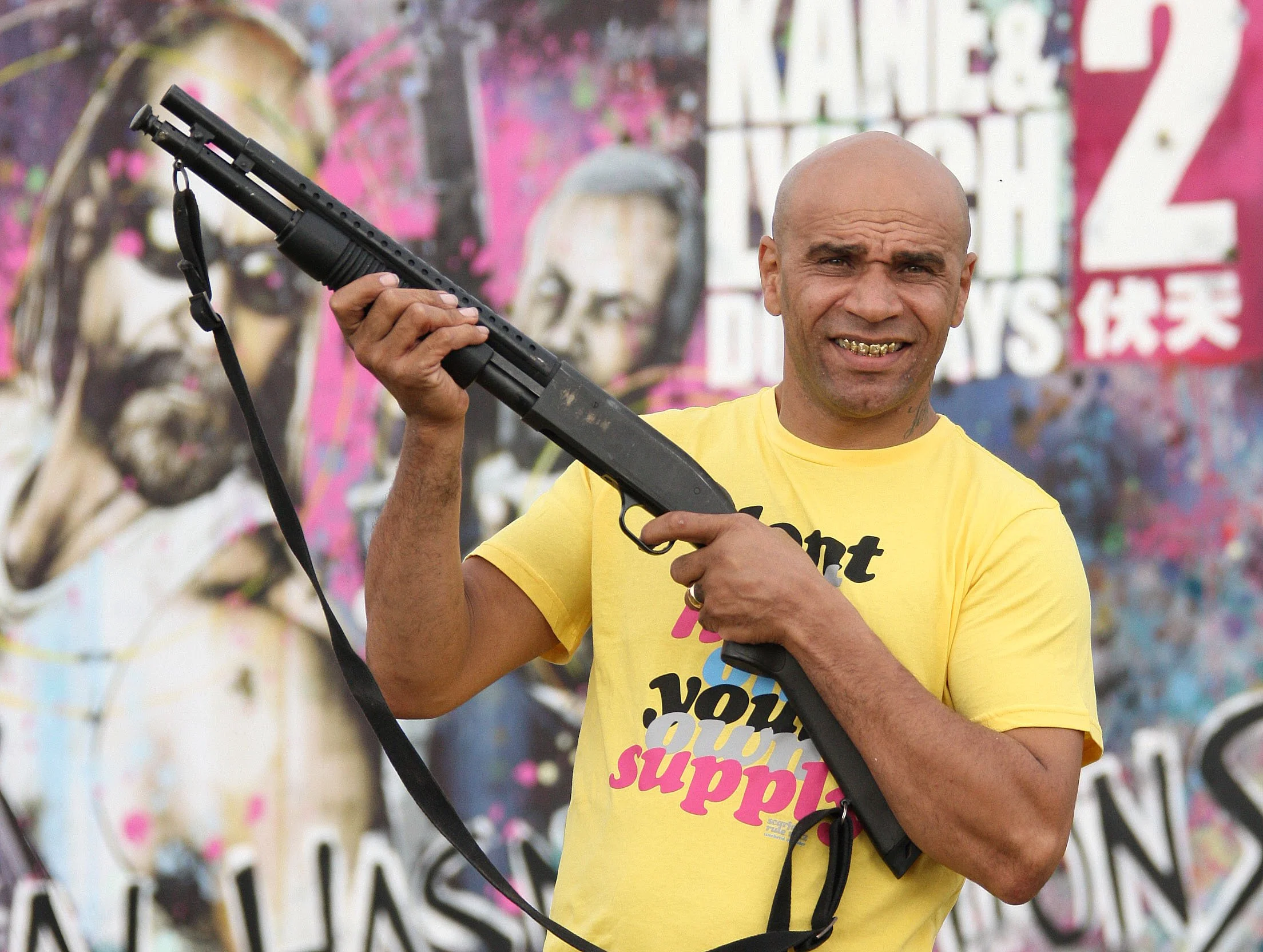 Goldie with shotgun