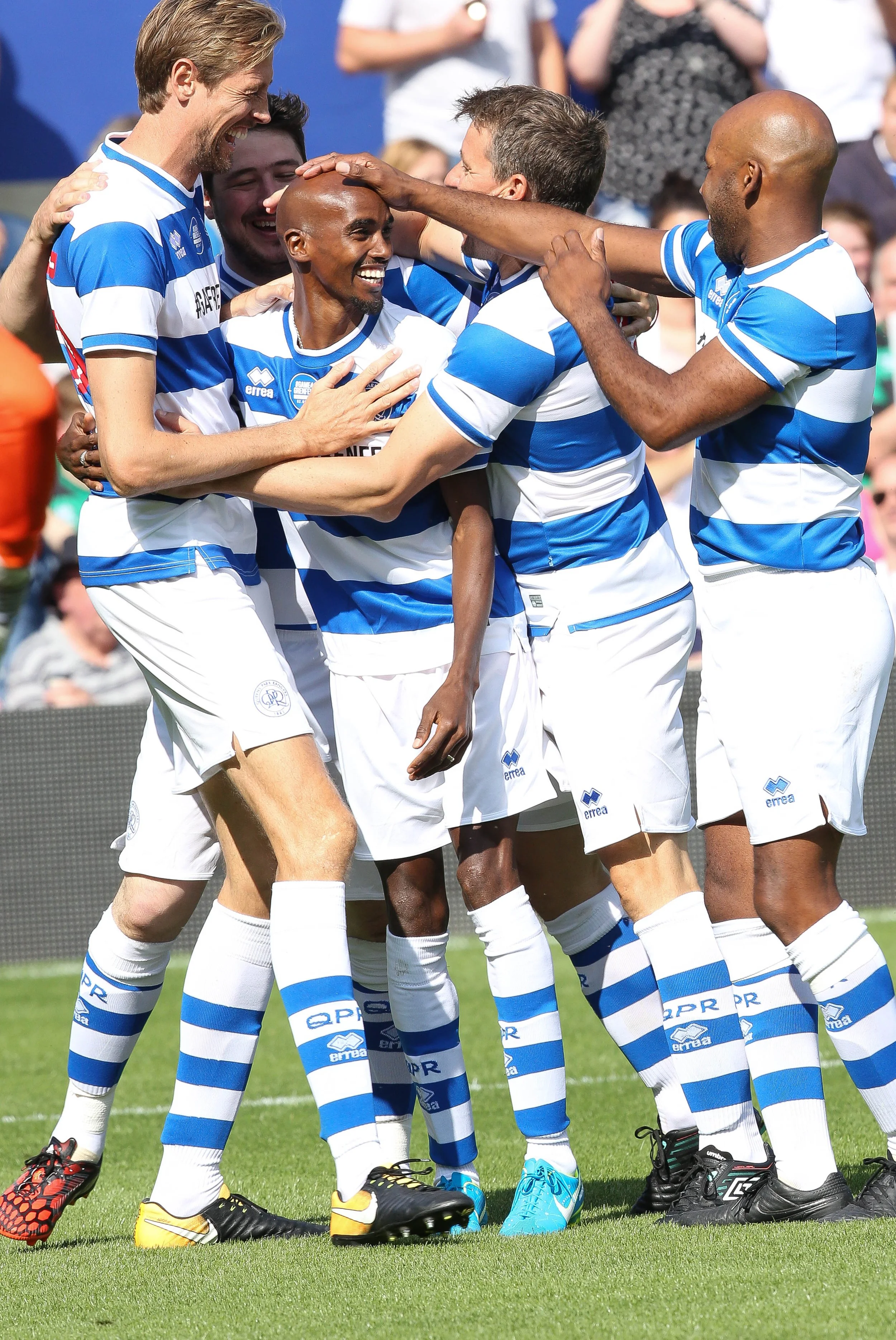 Mo Farrah scores for his team with Damian Lewis at a 'Game for Grenfell"