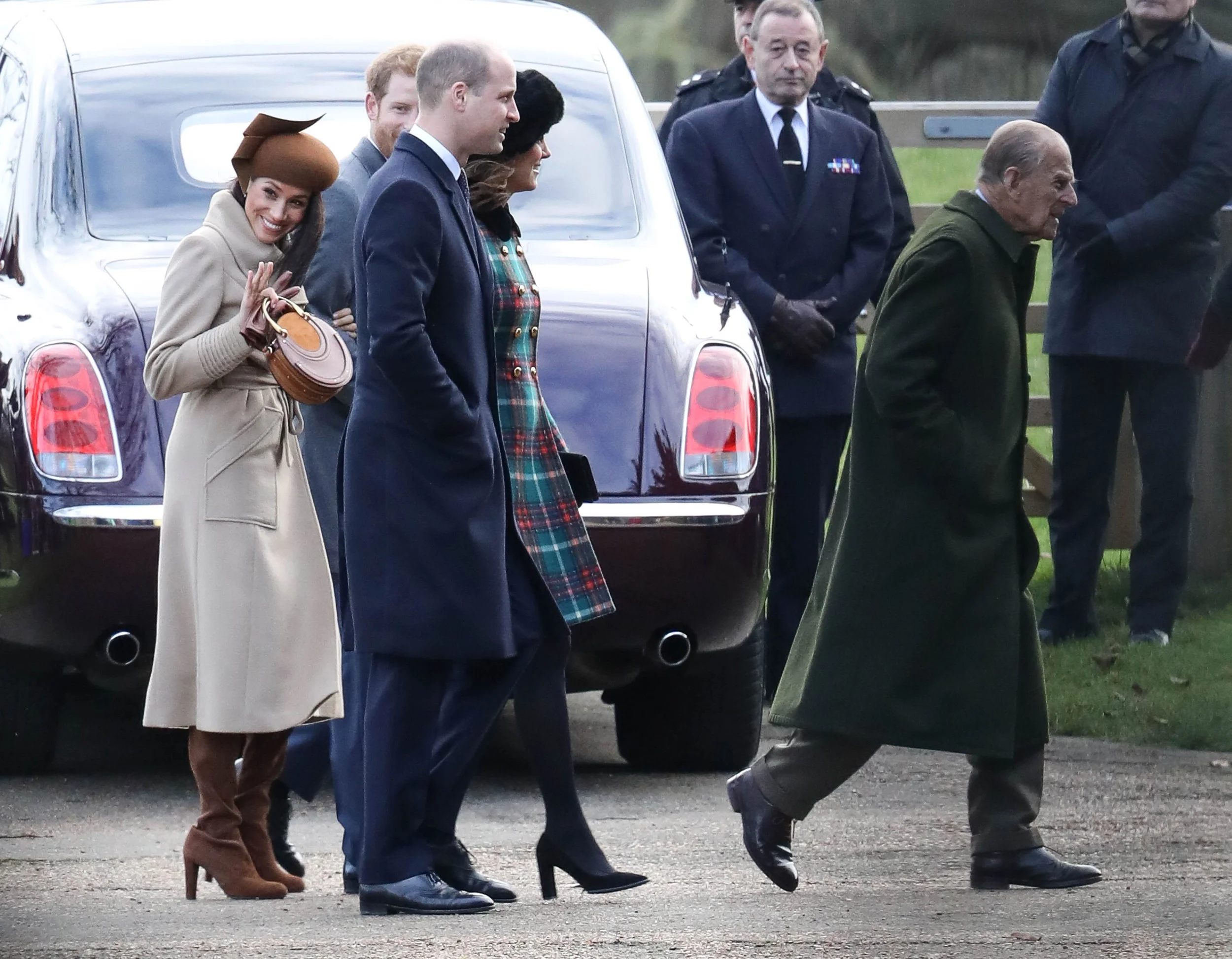 Meghan Markle waves to crowds at Sandringham Norfolk going to church service Christmas Day