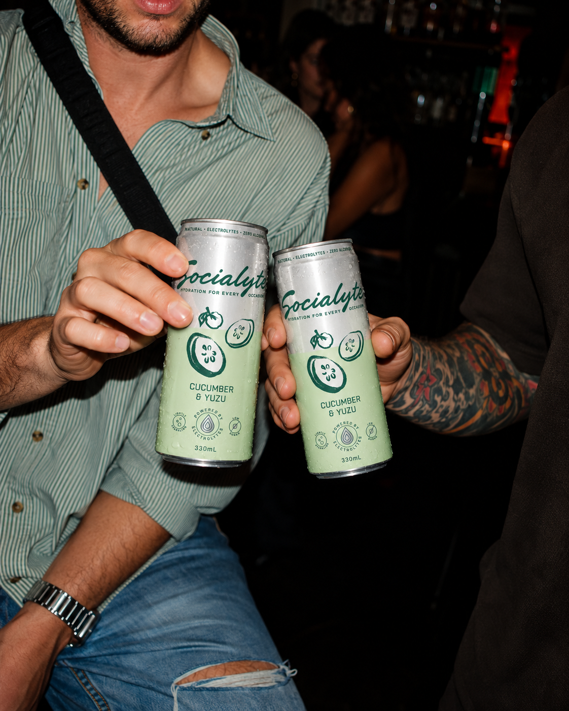 Clinking Socialyte Cucumber Yuzu Cans.png