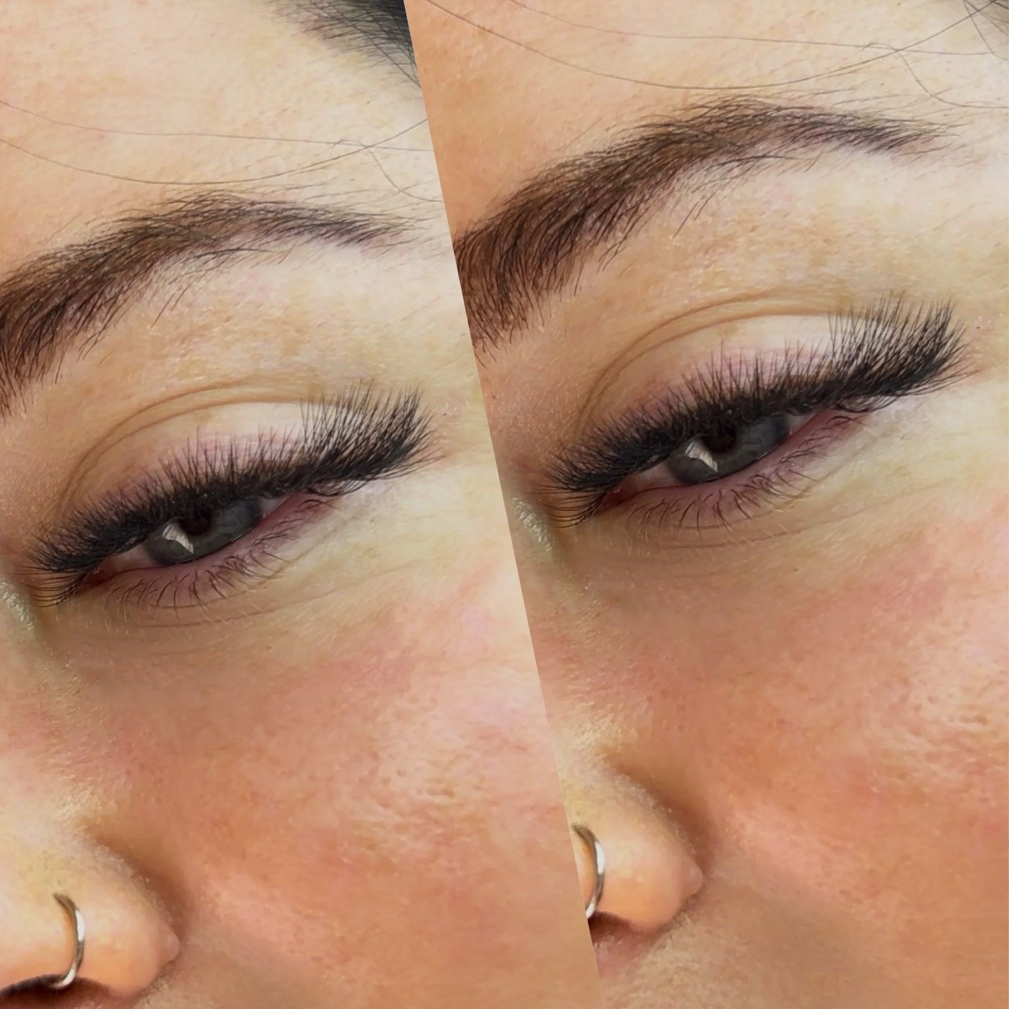 Close-up of a woman's face showing her forehead, eyebrows, upper eyelids, and part of her nose with a small hoop nose ring.