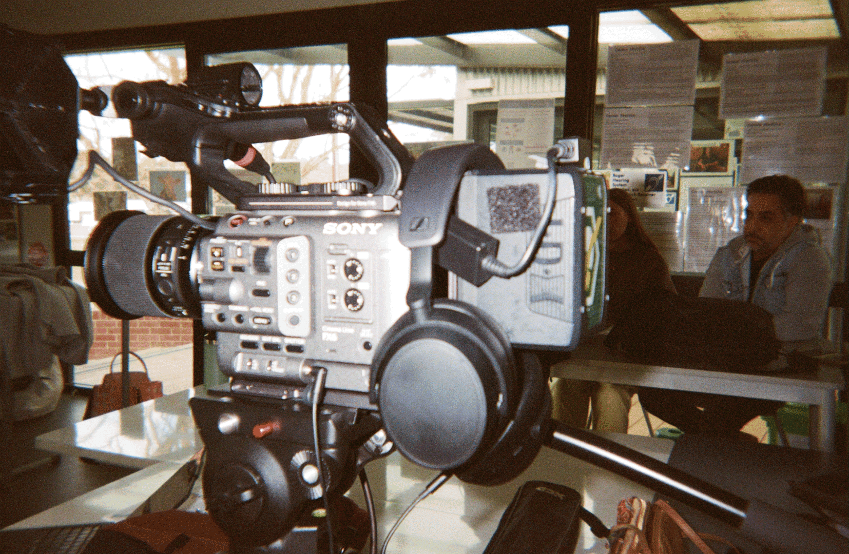 A scrolling gif of film photos, featuring people connecting, creating, building communities.