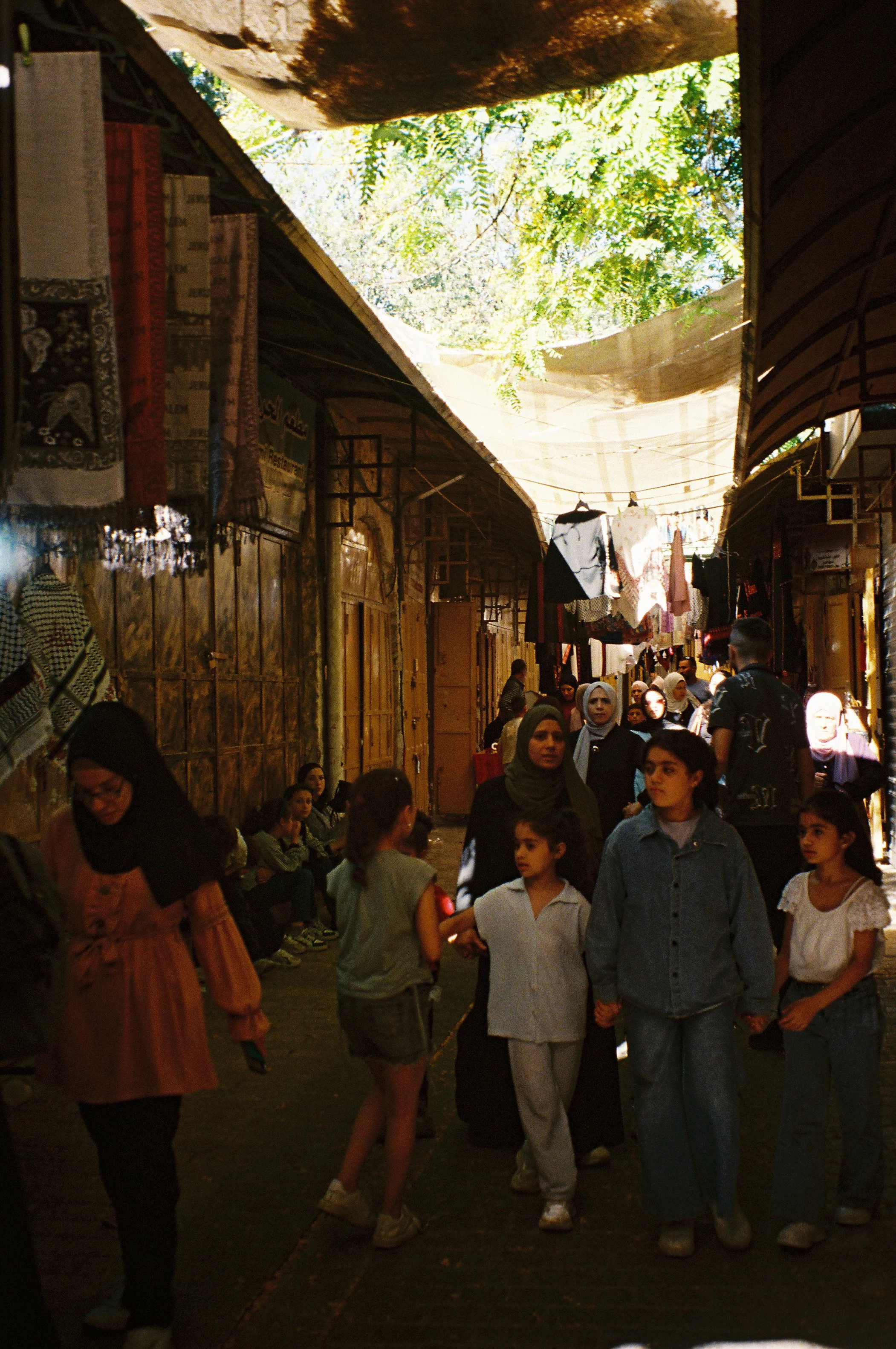 Palestinians Wait in Alleyway for Streets to Open After Israeli Settler Tour