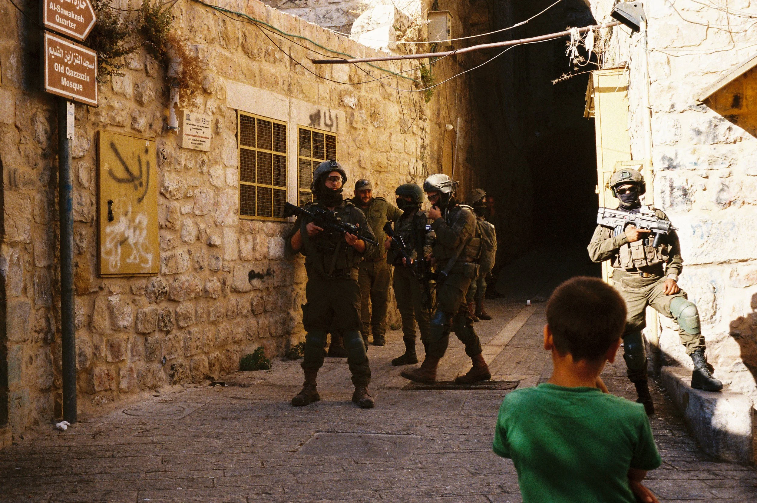 IOF Points Guns at Child