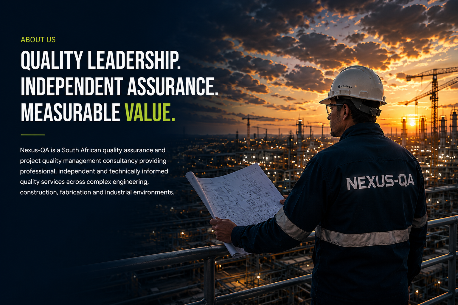 A person in a hard hat and jacket with 'NEXUS-QA' on the back, holding construction plans while overlooking an industrial site at sunset with cranes and machinery.