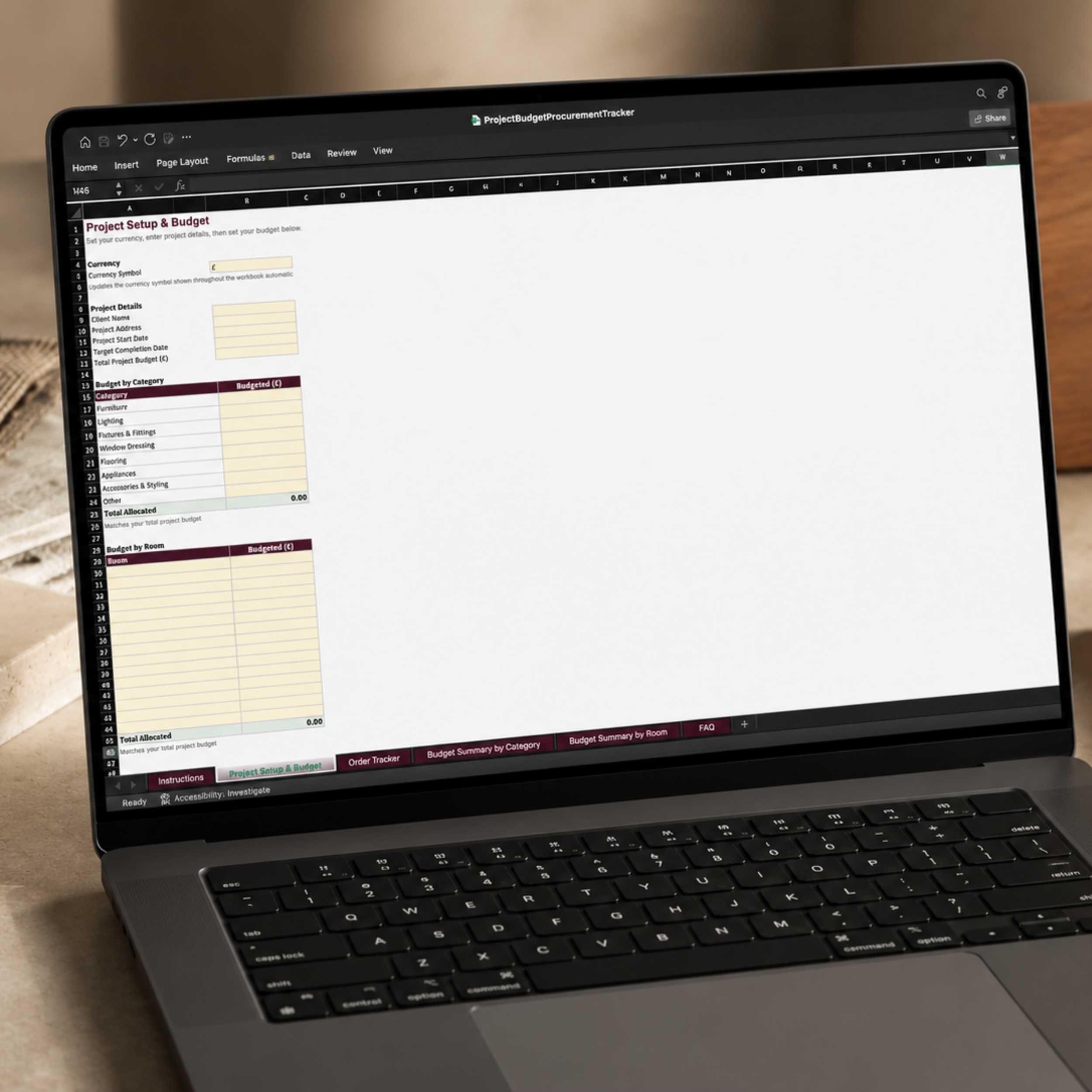 The Project Budget and Procurement Tracker Excel workbook open on a laptop