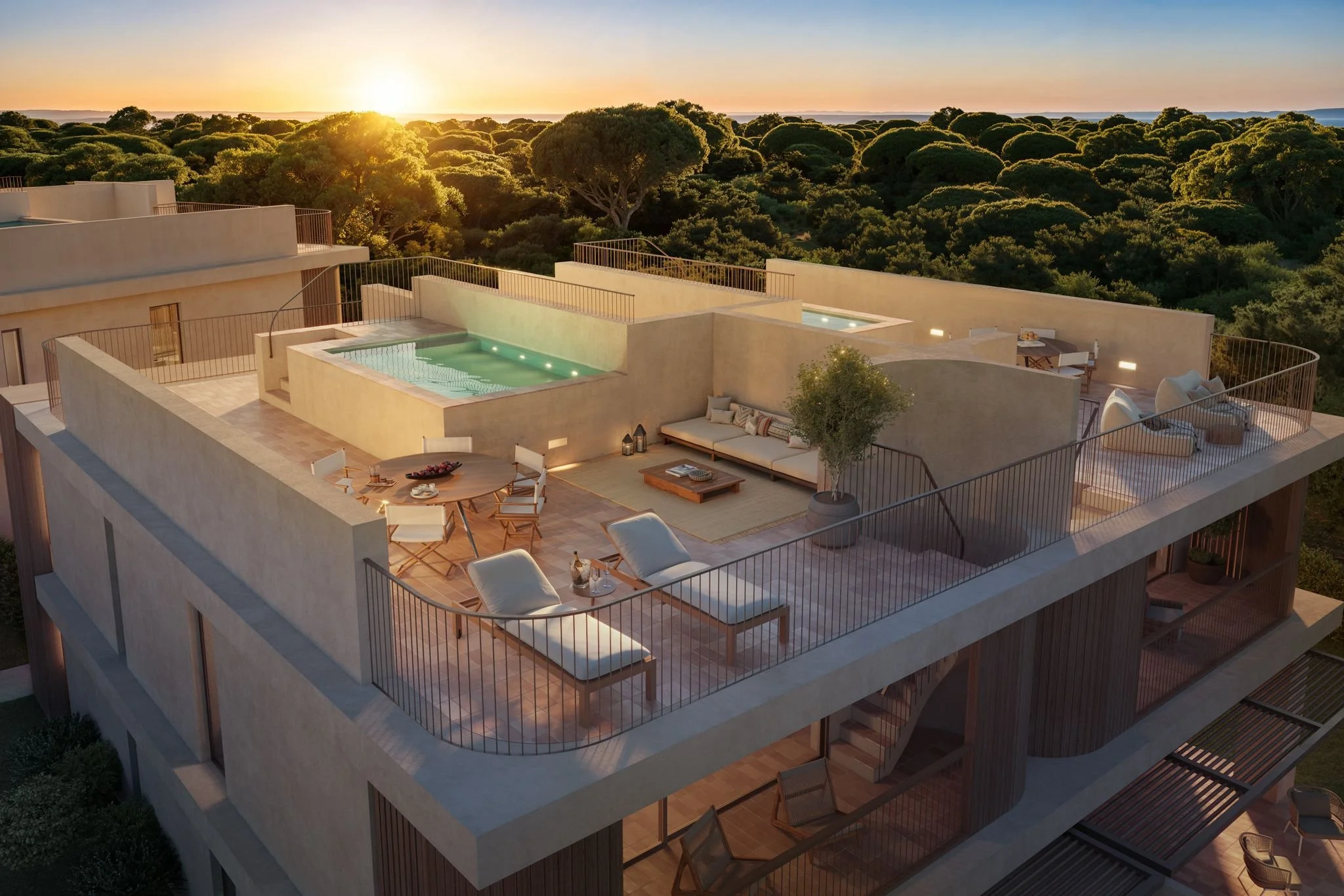 Modern apartment complex with balconies and greenery, surrounding a swimming pool area with lounge chairs and umbrellas under a clear blue sky.