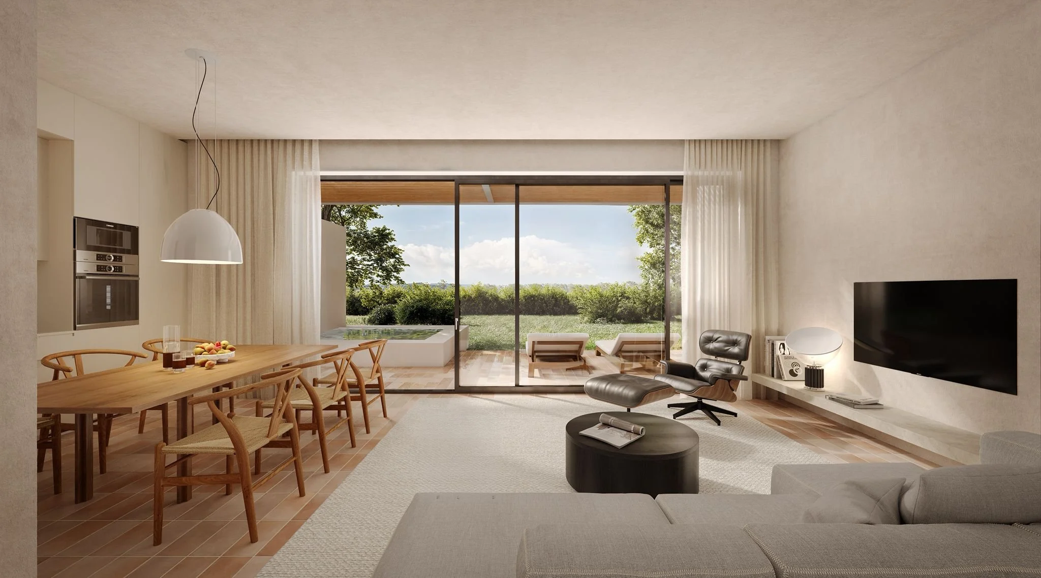 Modern open-plan living room and kitchen with light-colored walls, wooden dining table, and a black coffee table.