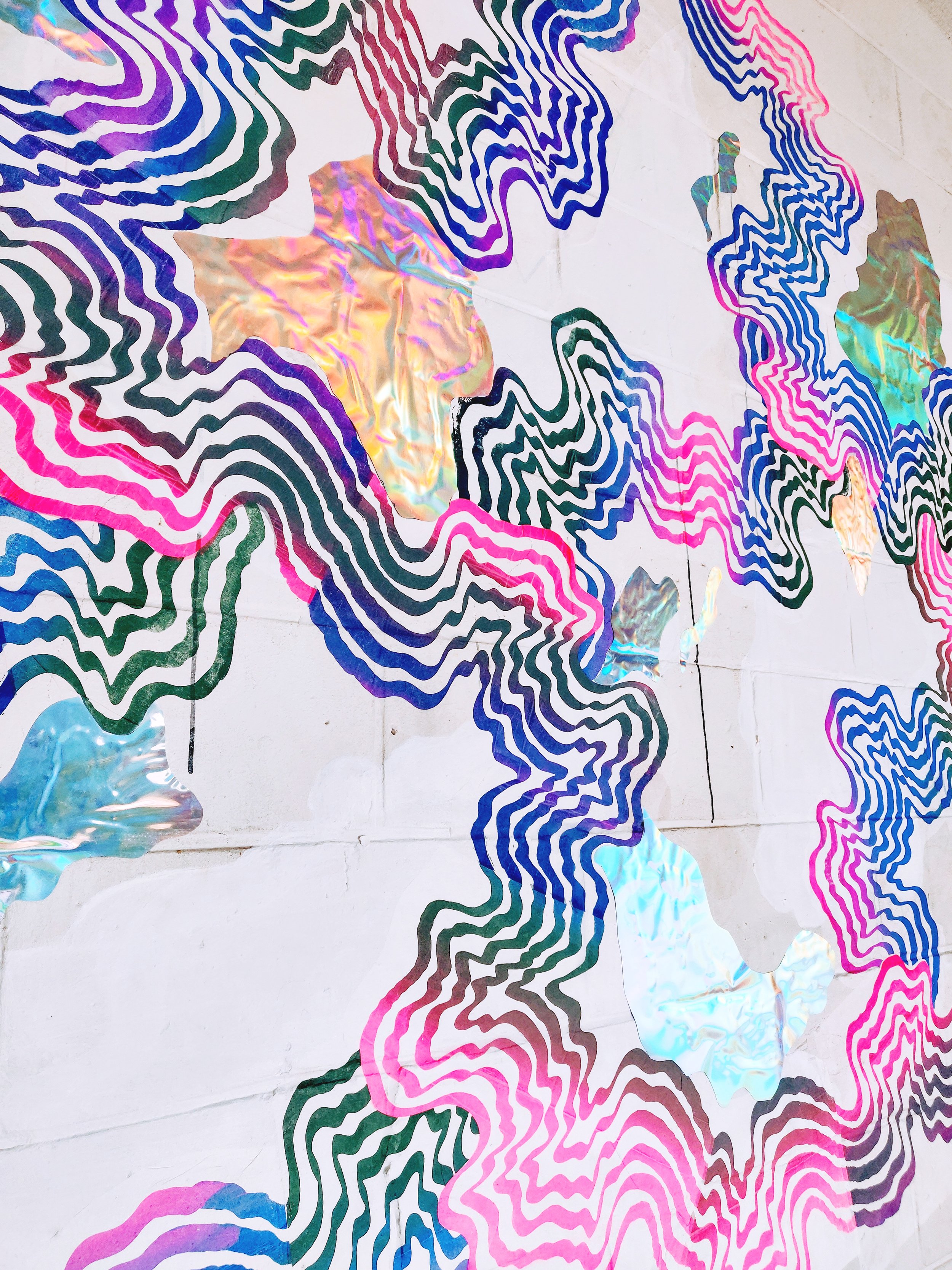 Colorful abstract art with wavy lines and iridescent patches on a white background.