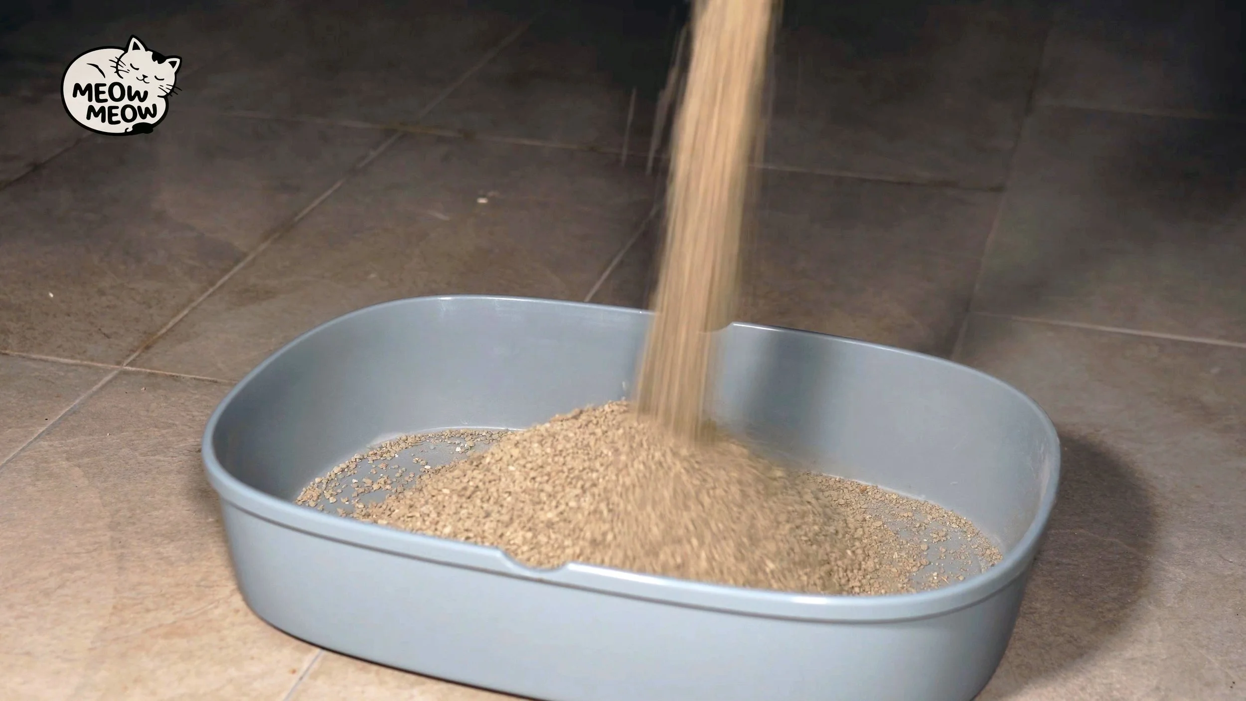 Clay cat litter being poured into a tray with visible dust rising