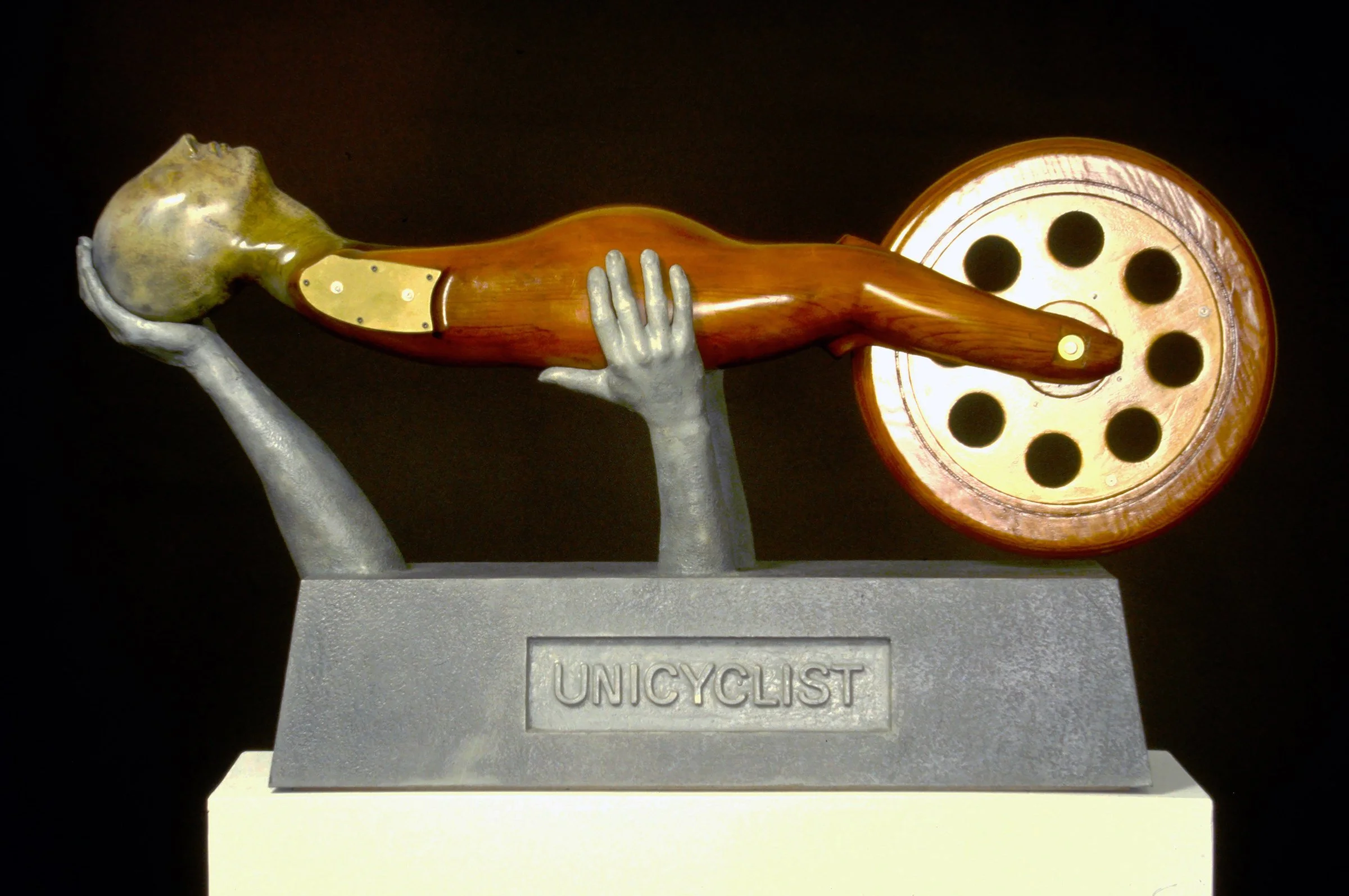 20. Unicyclist, 1988, fiberglass and wood, 48” X 30” X 18”..JPG