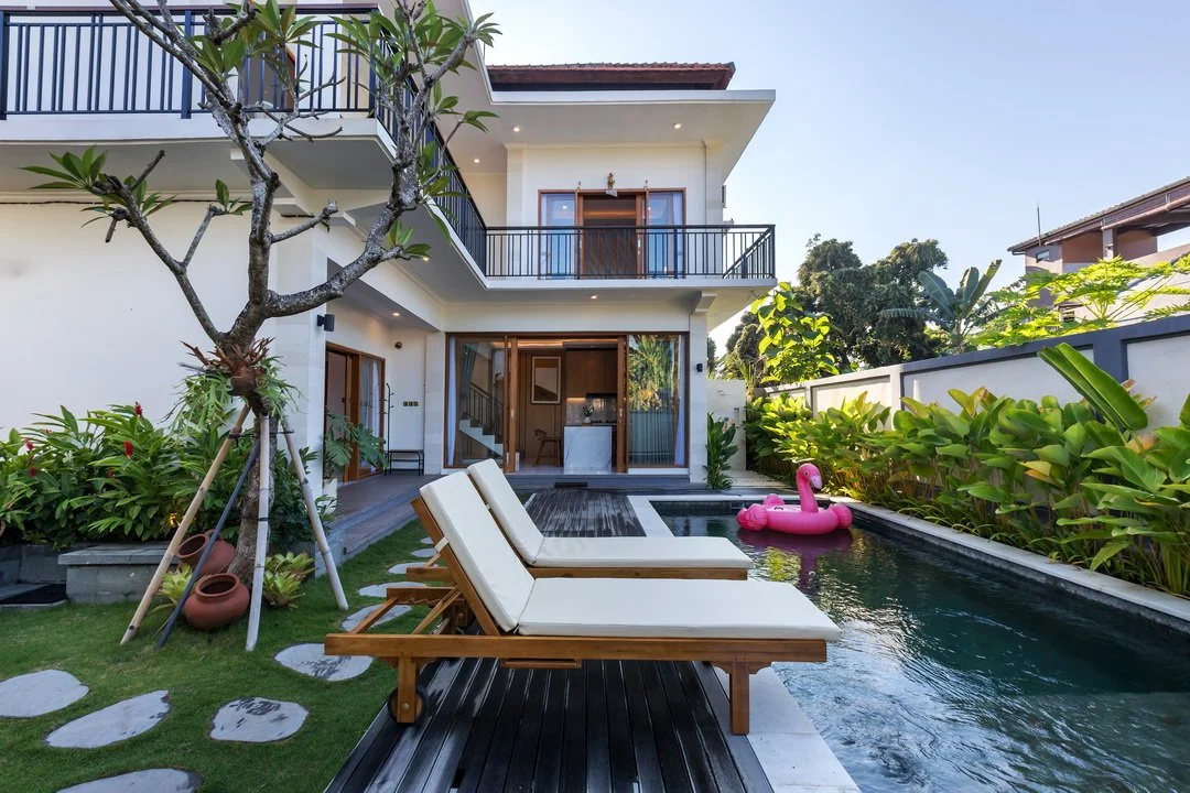 Private swimming pool surrounded by tropical gardens at Villa Anali