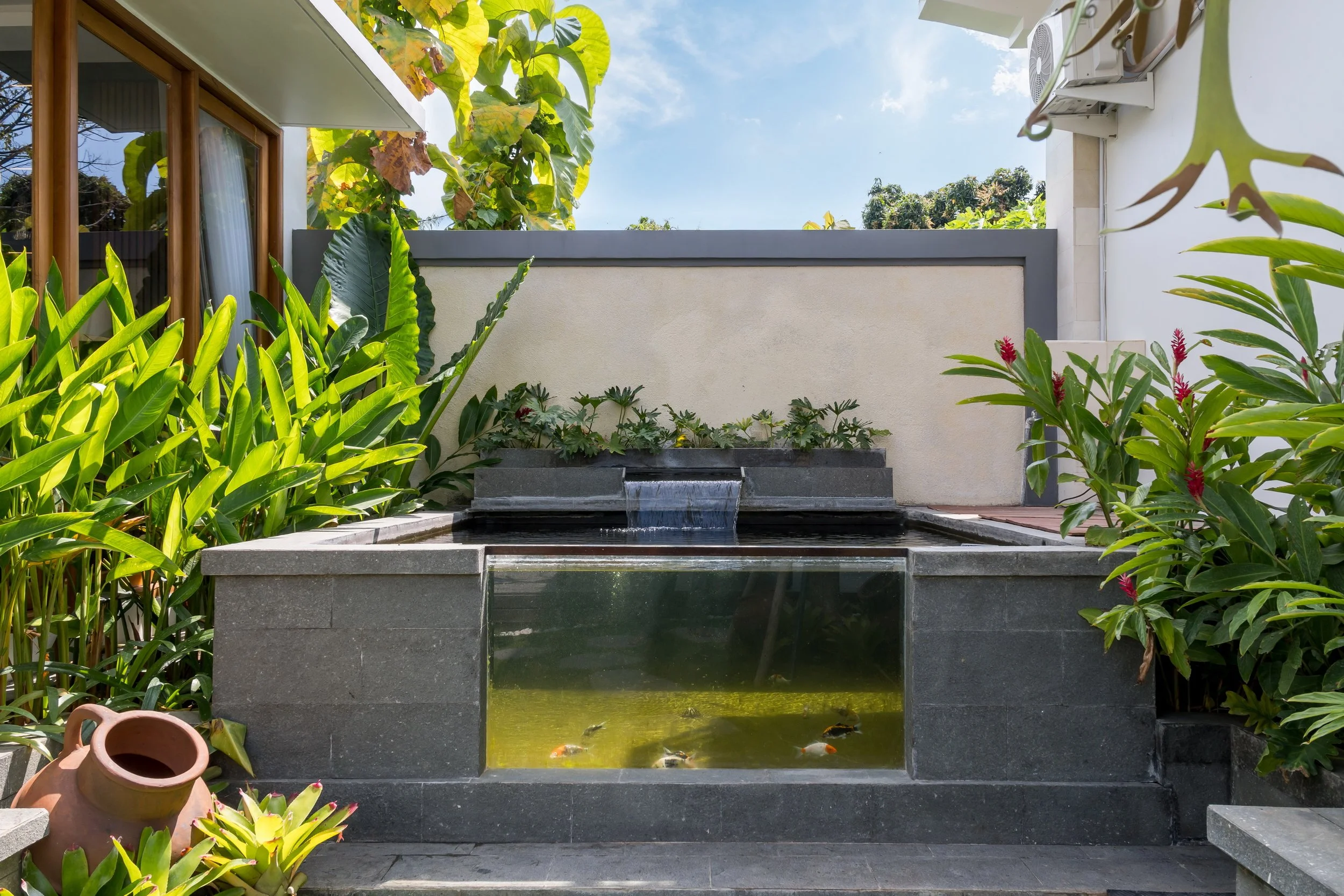 Tropical fish pond providing a peaceful garden retreat at Villa Anali