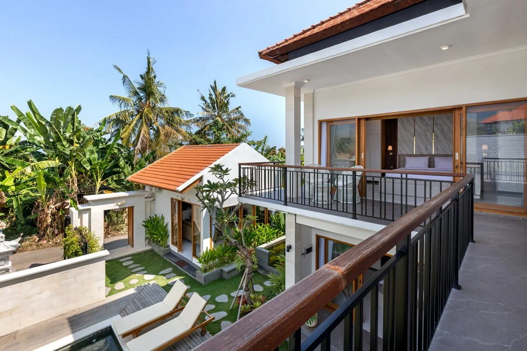 Private balcony overlooking tropical gardens at Villa Anali