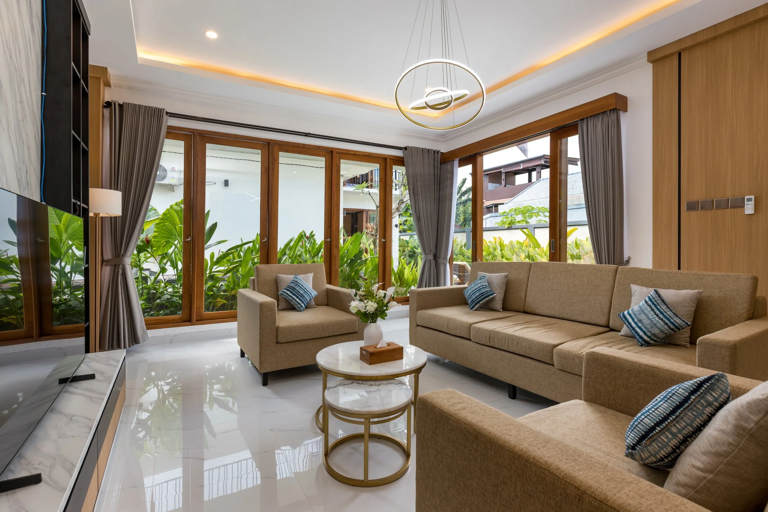 Modern living room at Villa Anali with comfortable seating and garden views