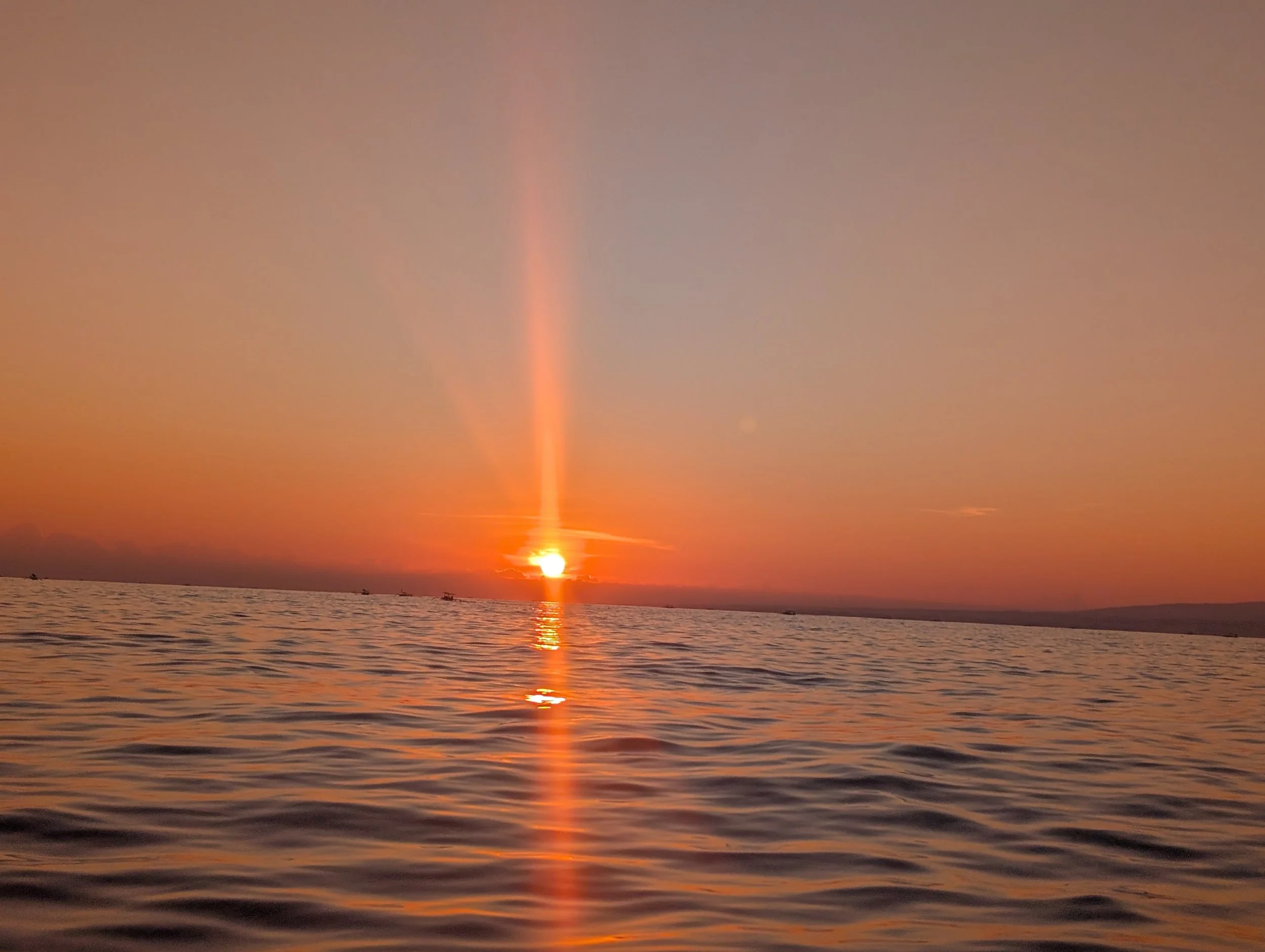 Golden sunset over the sea at Lovina Beach in North Bali