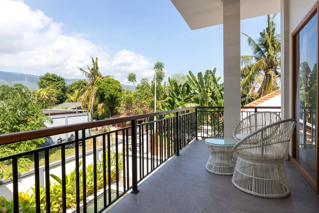 Private balcony overlooking tropical gardens at Villa Anali