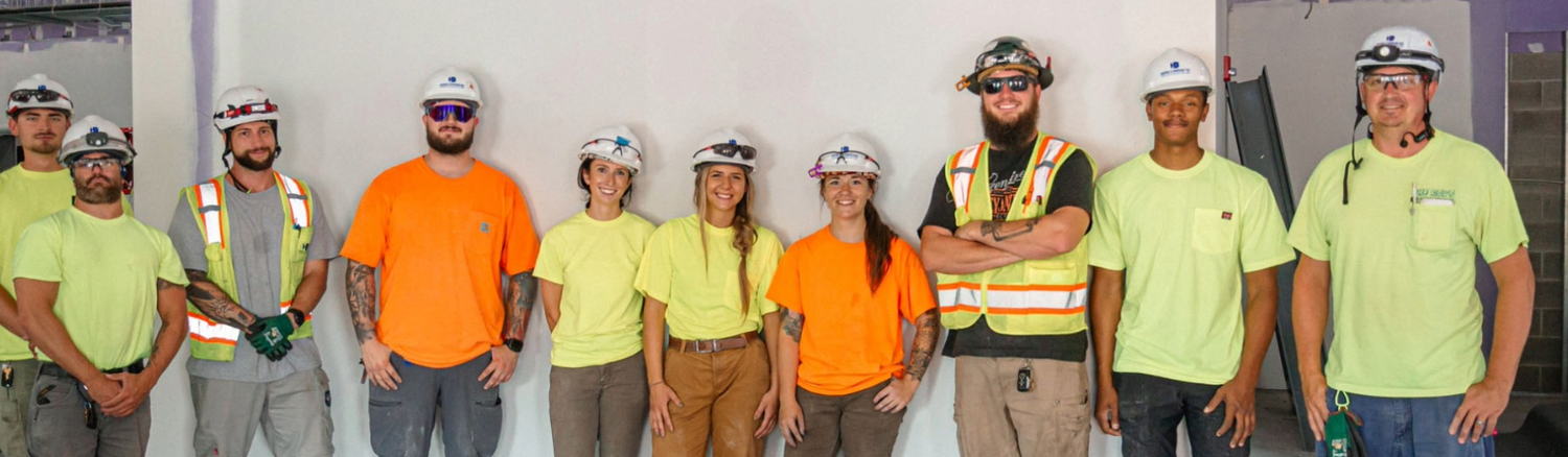 A crew of electricians and apprentices