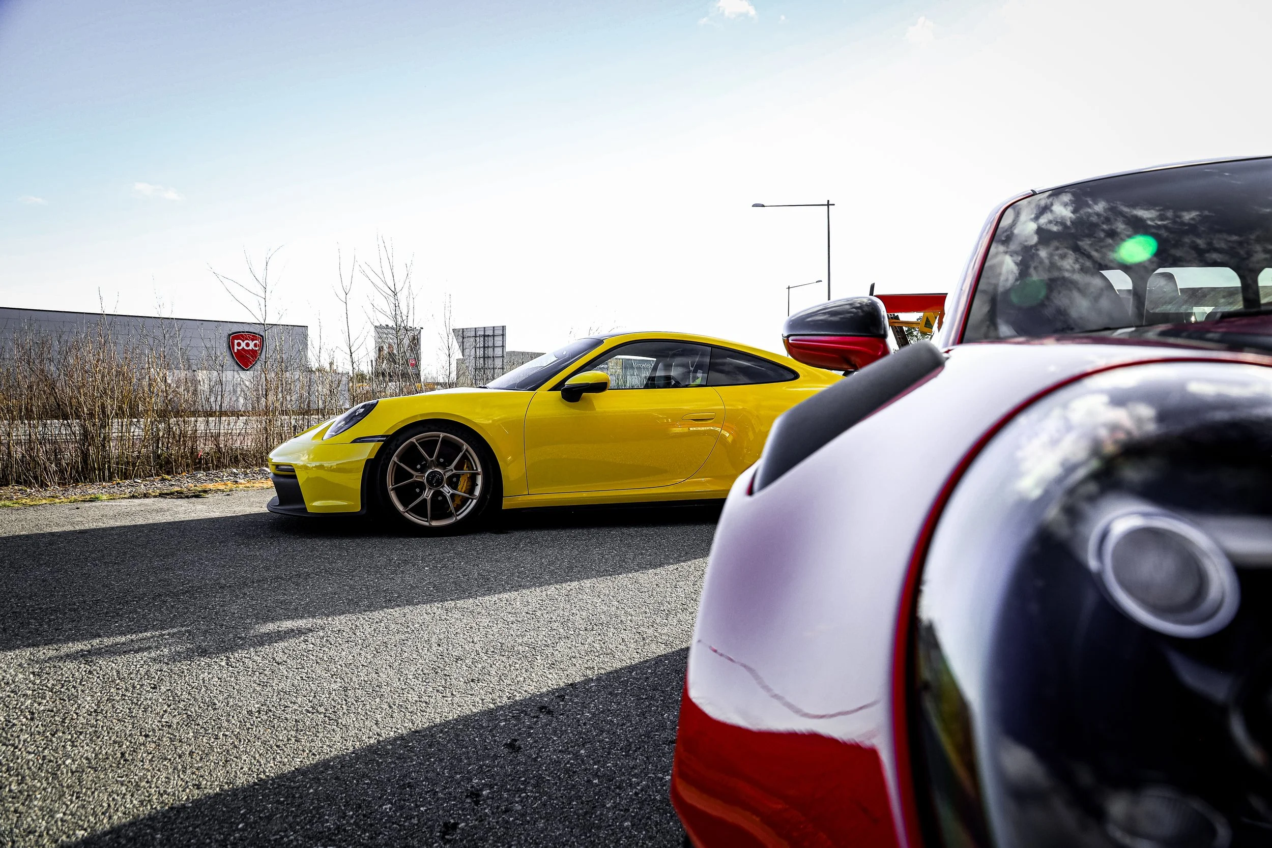 Final result of installed PPF on the Yellow Porsche GT3 and Red Porsche GT3 RS at Wrapster in Örebro, Sweden, photographed by Annika TheVolvoGirl Miftakhova.