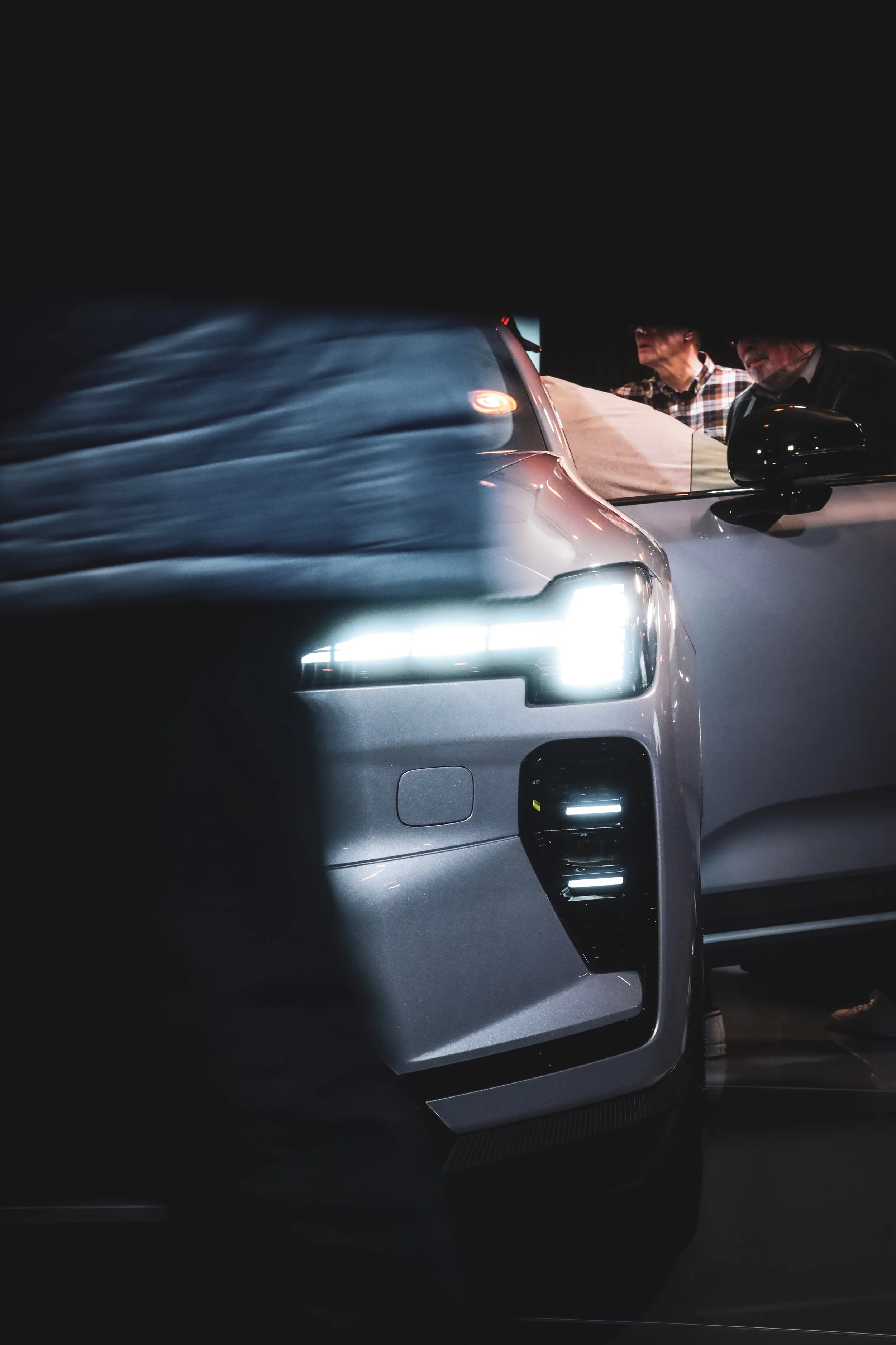 Silver Volvo EX60 front light in the centre of attention at Finlandia Hall in Helsinki, Finland photographed by Annika TheVolvoGirl Miftakhova