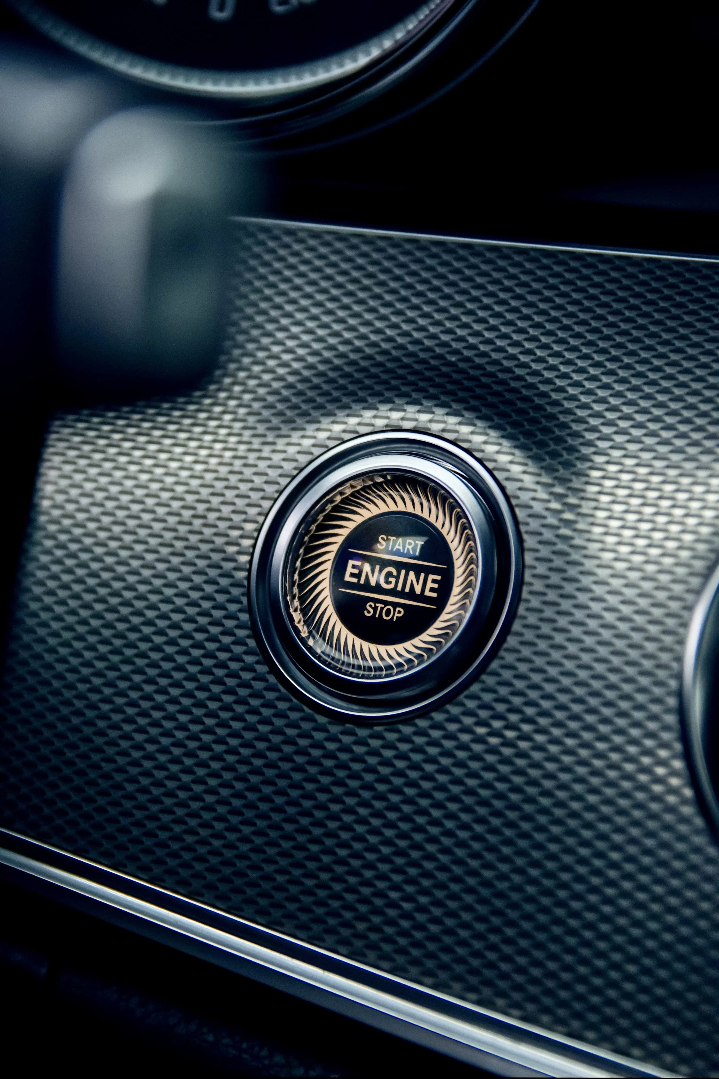 Close-up of start button of Black Mercedes-Benz E-class car photographed by Annika TheVolvoGirl Miftakhova for Parrotz Suomi in Helsinki, Finland