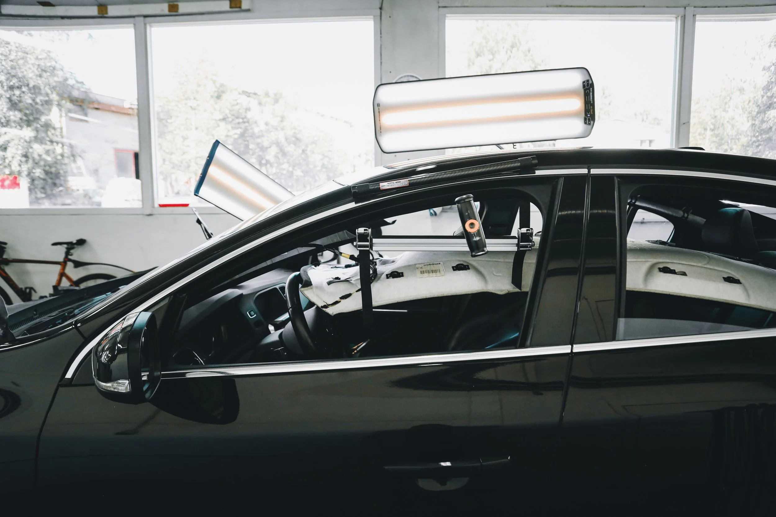 Light set up on the car for paintless dent repair photographed by Annika TheVolvoGirl Miftakhova in Helsinki, Finland