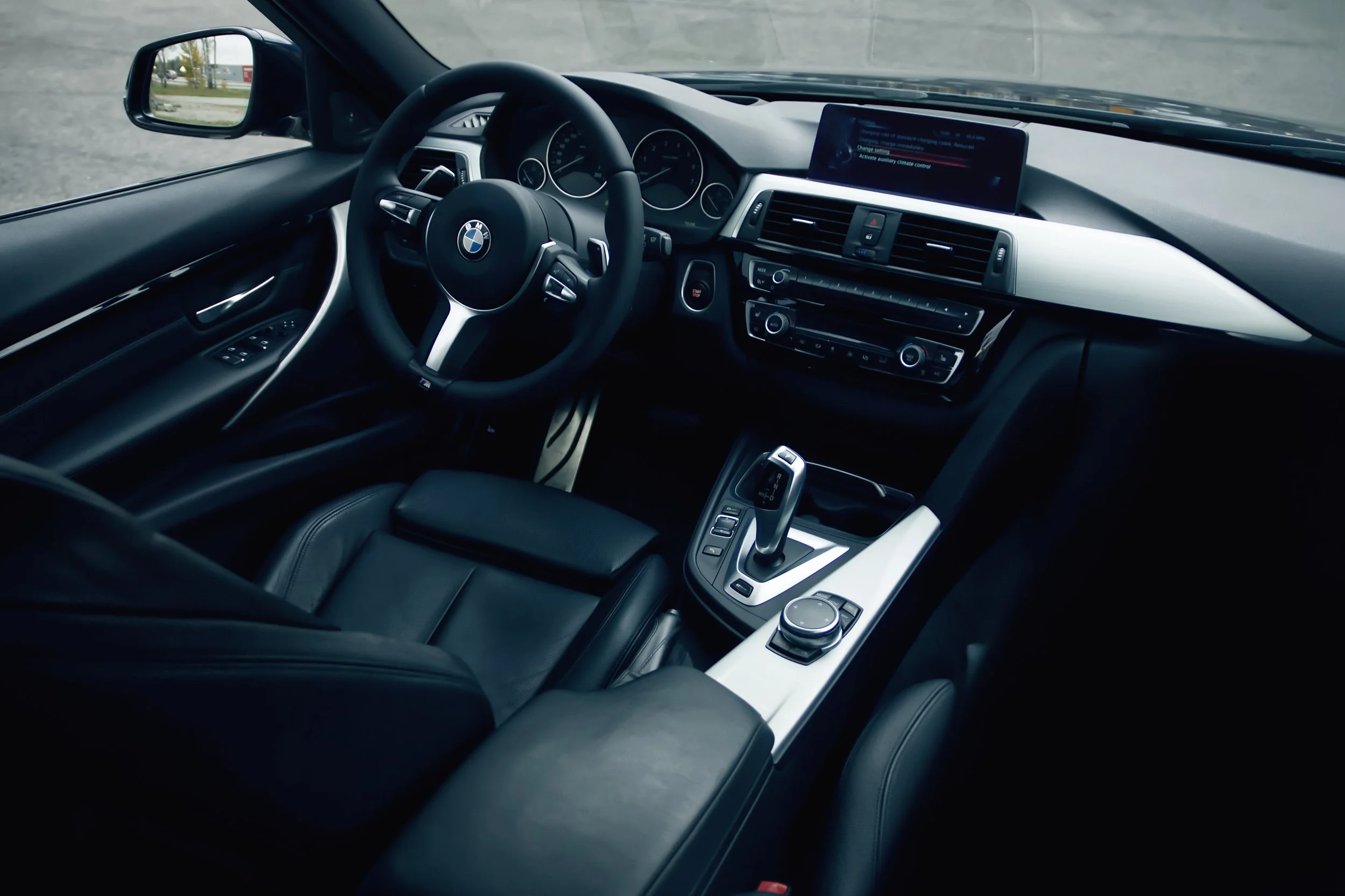 Interior of Blue BMW 3-series car photographed by Annika TheVolvoGirl Miftakhova for Parrotz Suomi in Helsinki, Finland