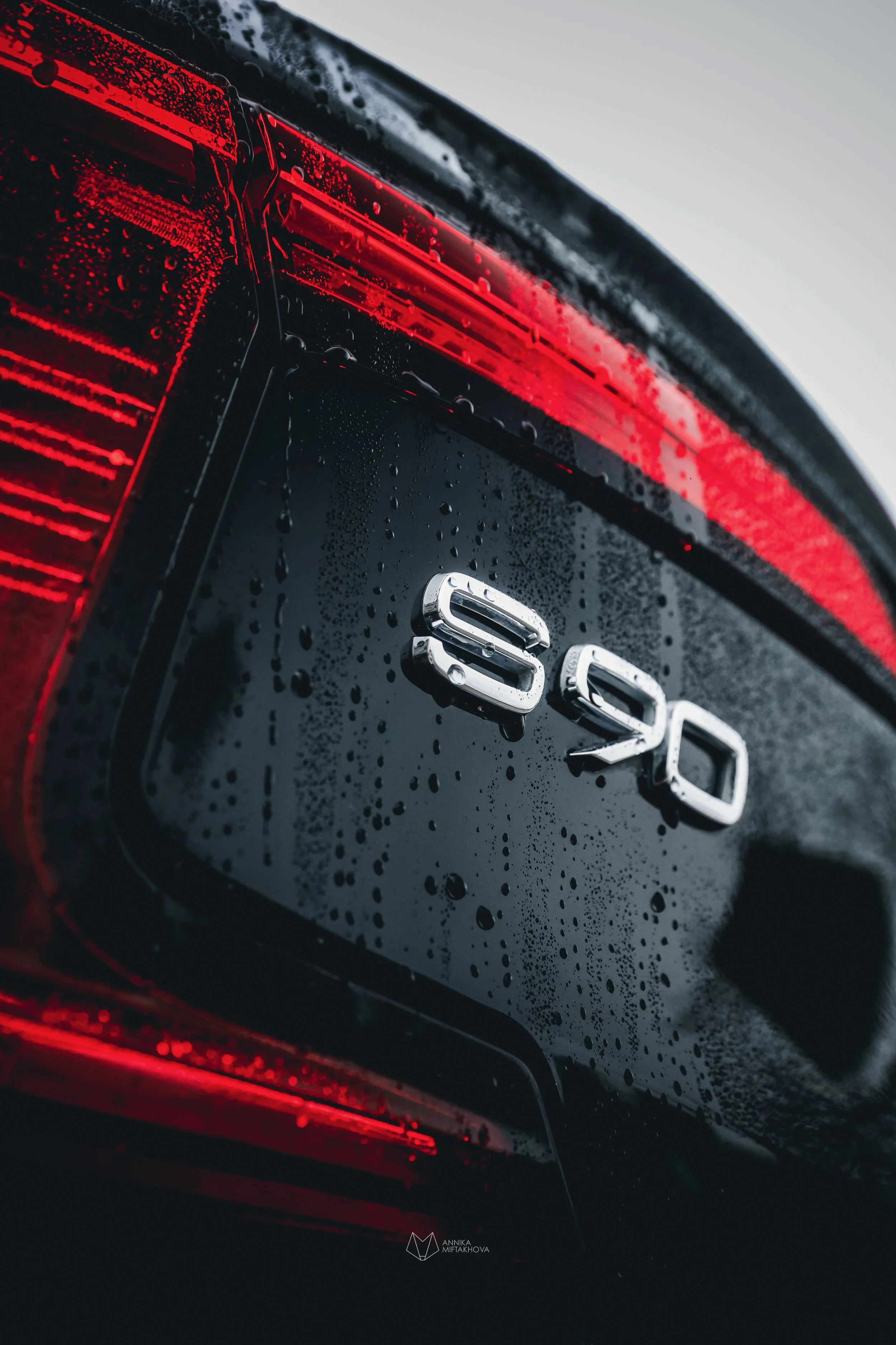 Black Volvo S90 rear model badges photographed in rain in Helsinki by Annika TheVolvoGirl Miftakhova 