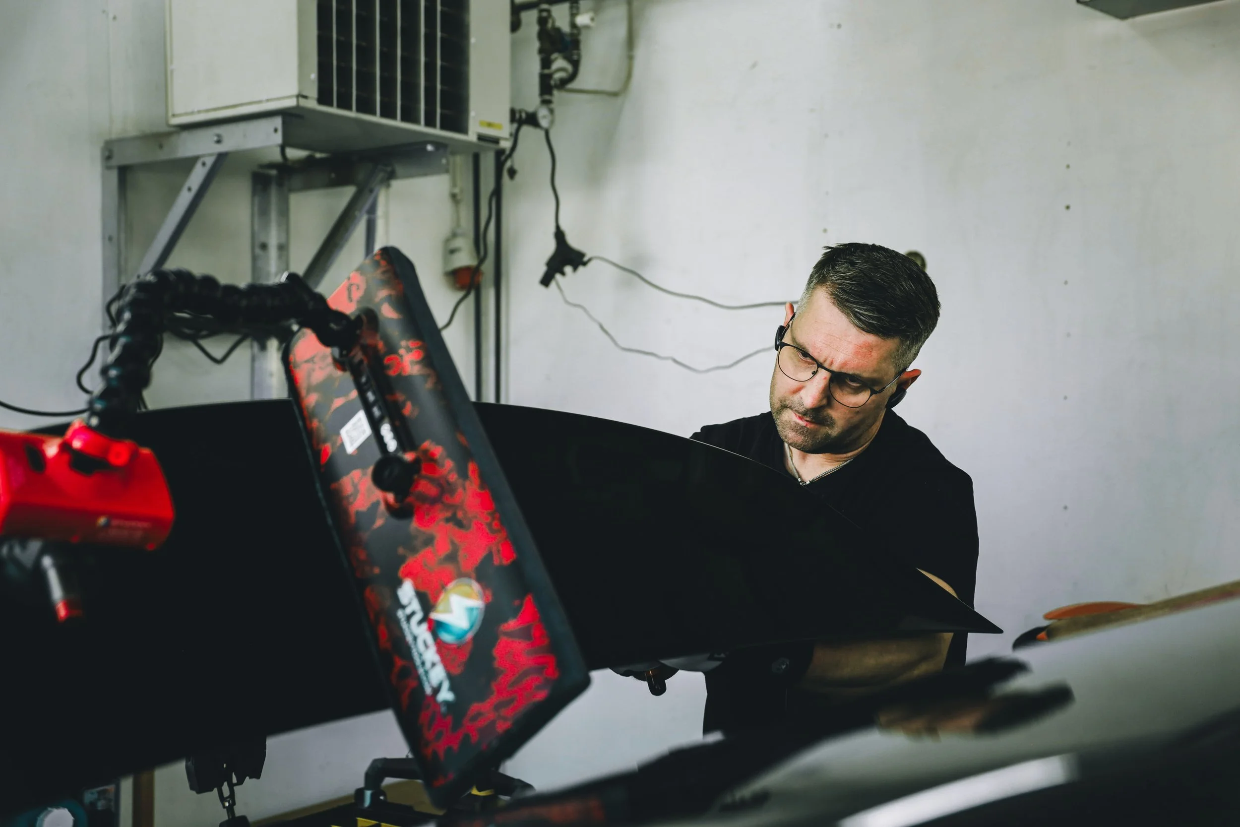 PDR expert working on the dents on the tailgate cover photographed by Annika TheVolvoGirl Miftakhova in Helsinki, Finland