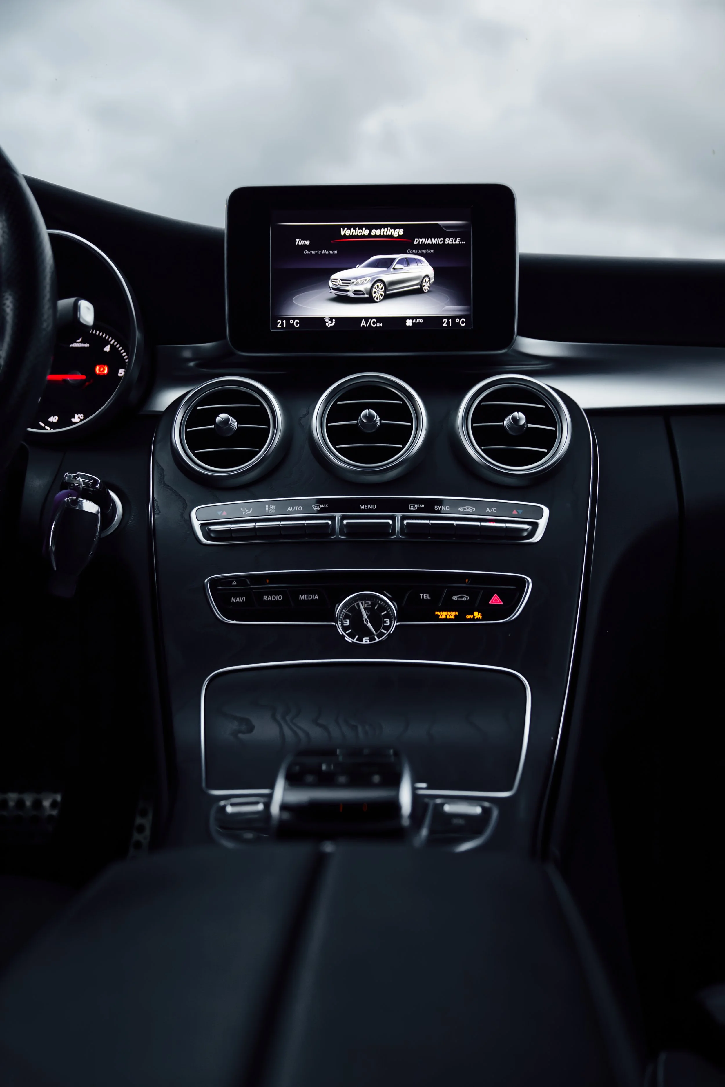 Central consode of Blue Mercedes-Benz C-class car photographed by Annika TheVolvoGirl Miftakhova for Parrotz Suomi in Helsinki, Finland