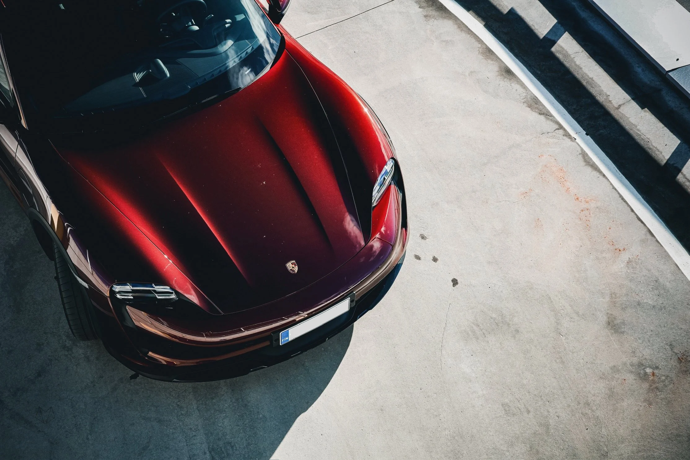 Red Porsche Taycan Cross car photographed for Porsche Finland by Annika TheVolvoGirl Miftakhova in Helsinki, Finland