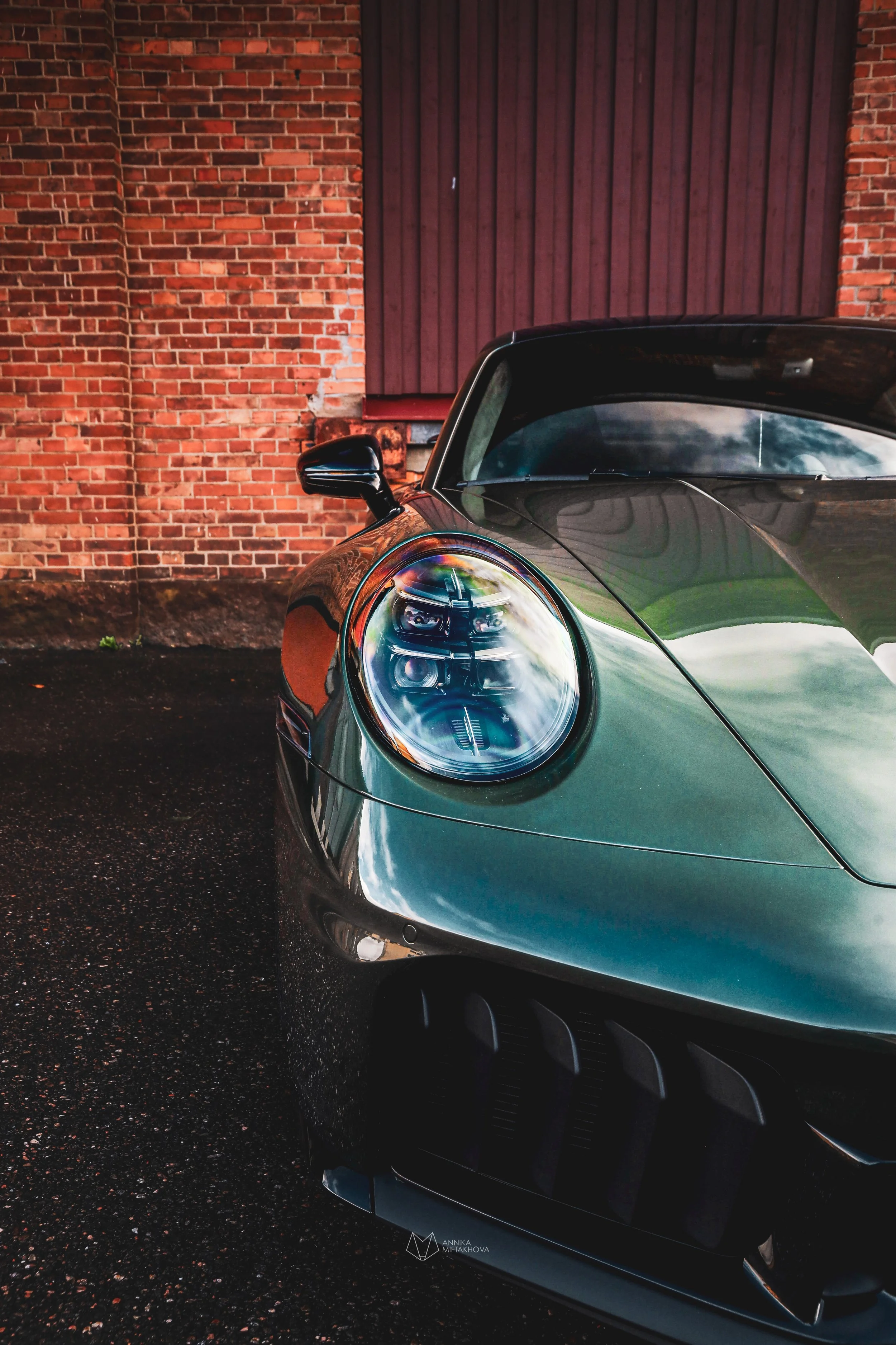 The headlight of Olive Green Porsche 911 photographed in Örebro, Sweden by Annika TheVolvoGirl Miftakhova