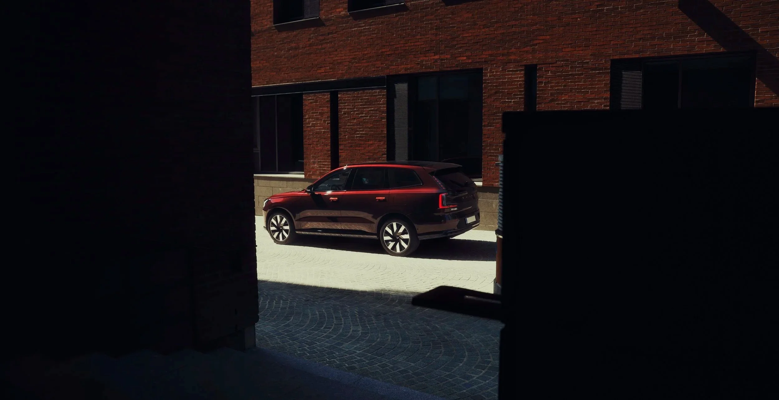 Red Volvo EX90 photographed by car photorgapher Annika TheVolvoGirl Miftalhova in Helsinki, Finland business disctrict