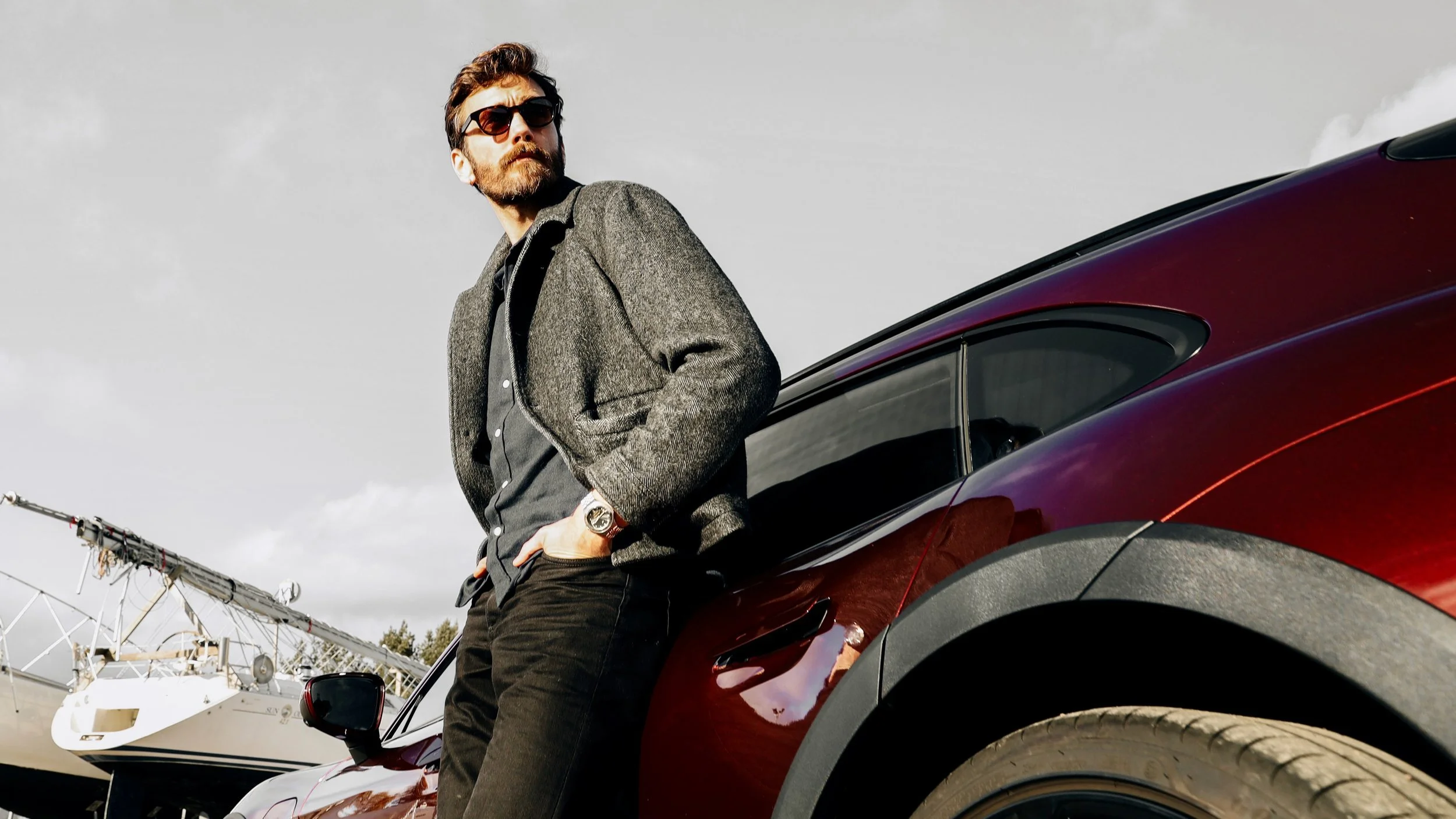 Male model and Red Porsche Taycan Cross car photographed for Porsche Finland by Annika TheVolvoGirl Miftakhova in Helsinki, Finland