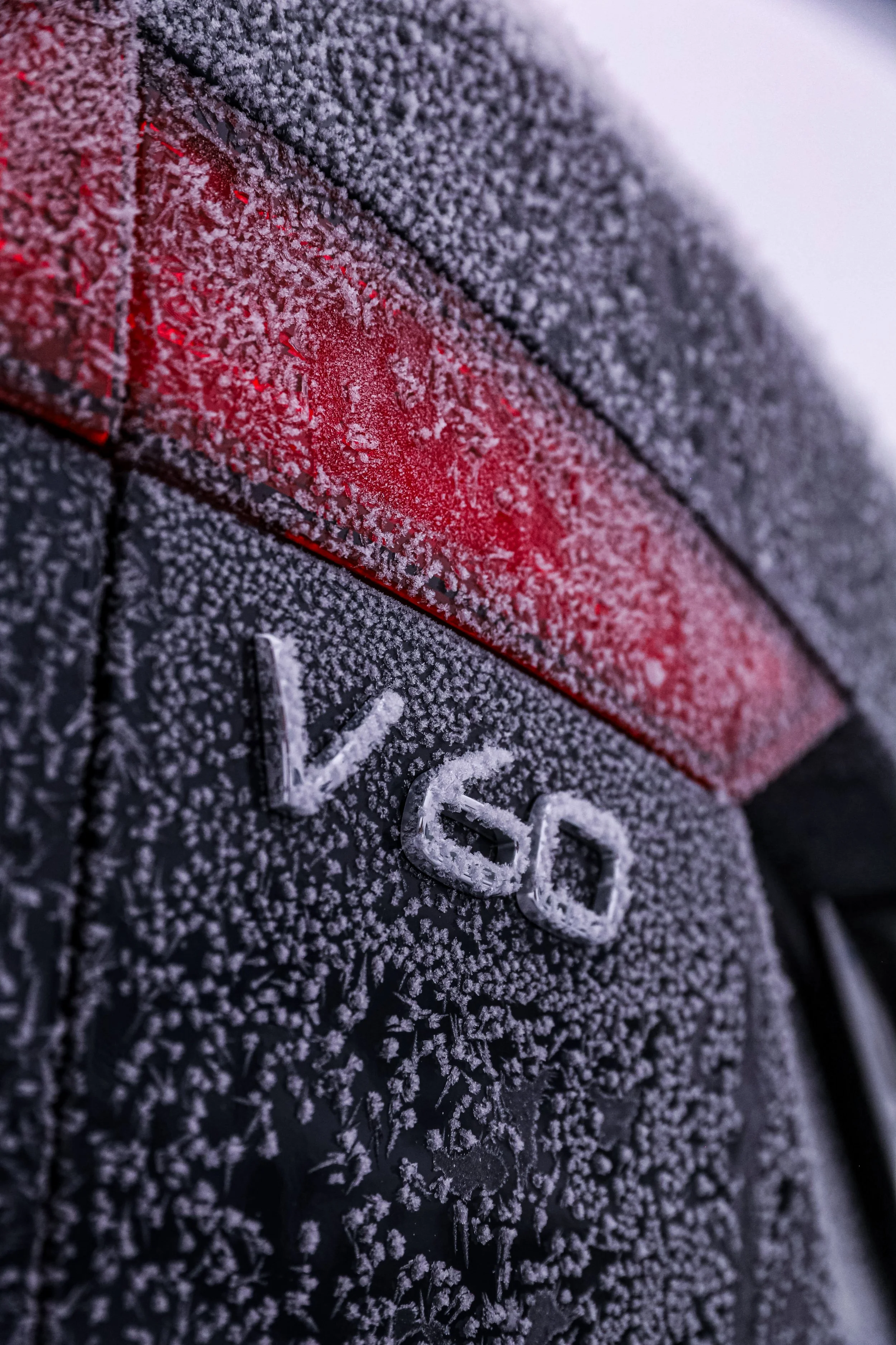 Black Volvo V60 rear model badges photographed in winter frost in Helsinki by Annika TheVolvoGirl Miftakhova 
