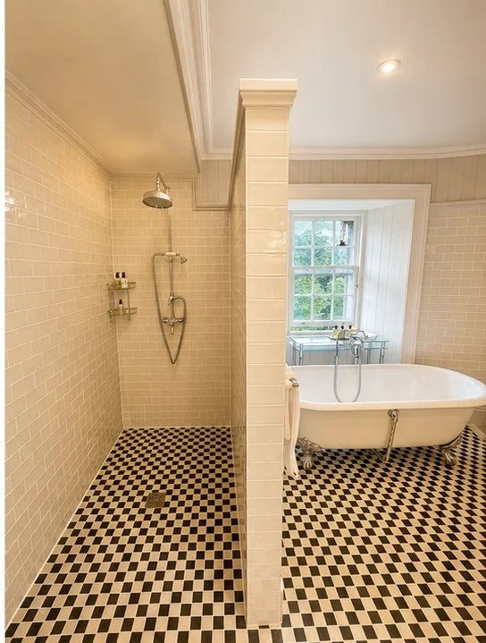 Large walk - in shower and free standing bath 