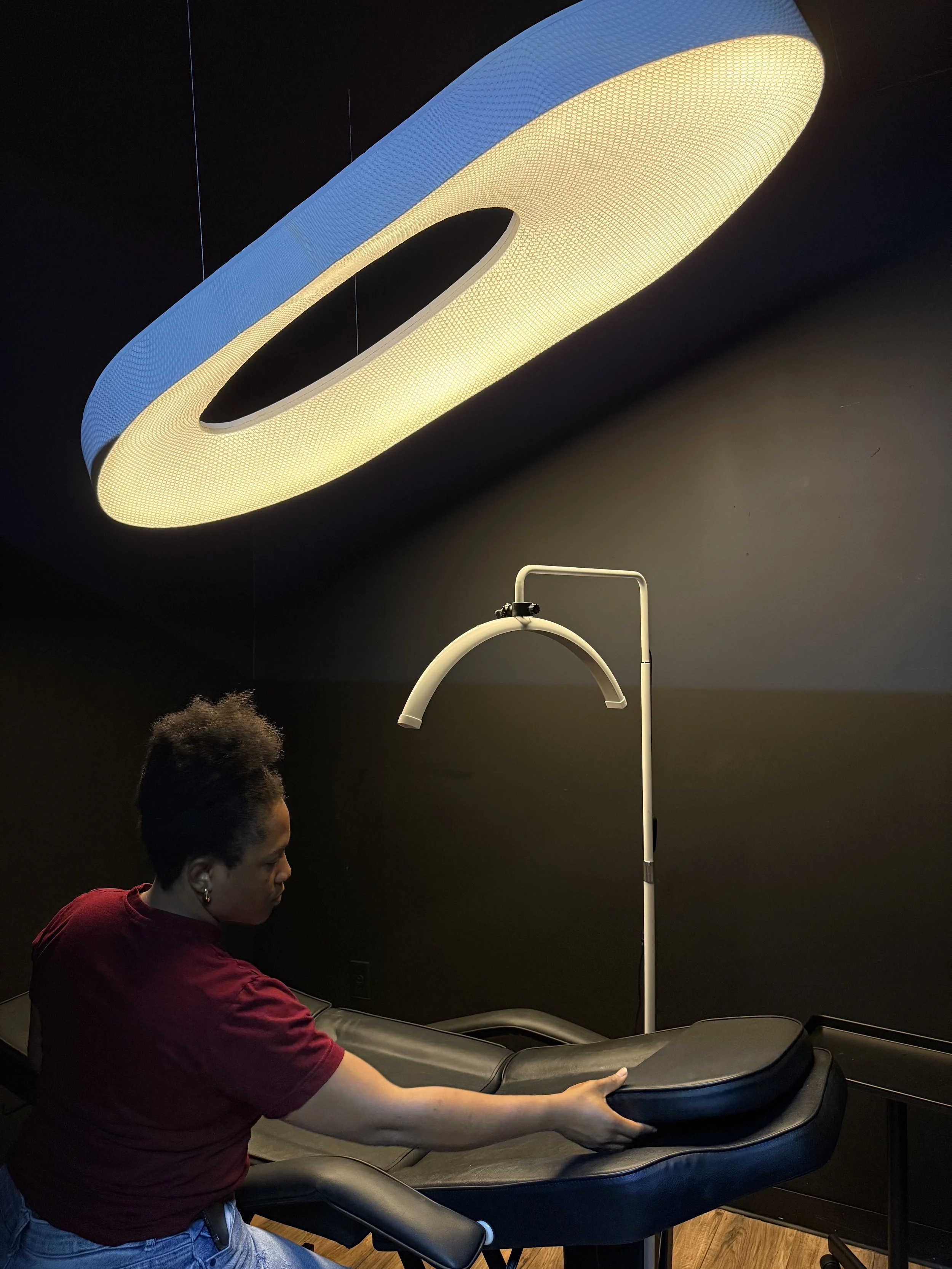 A large illuminated luxury and modern oval ceiling light.