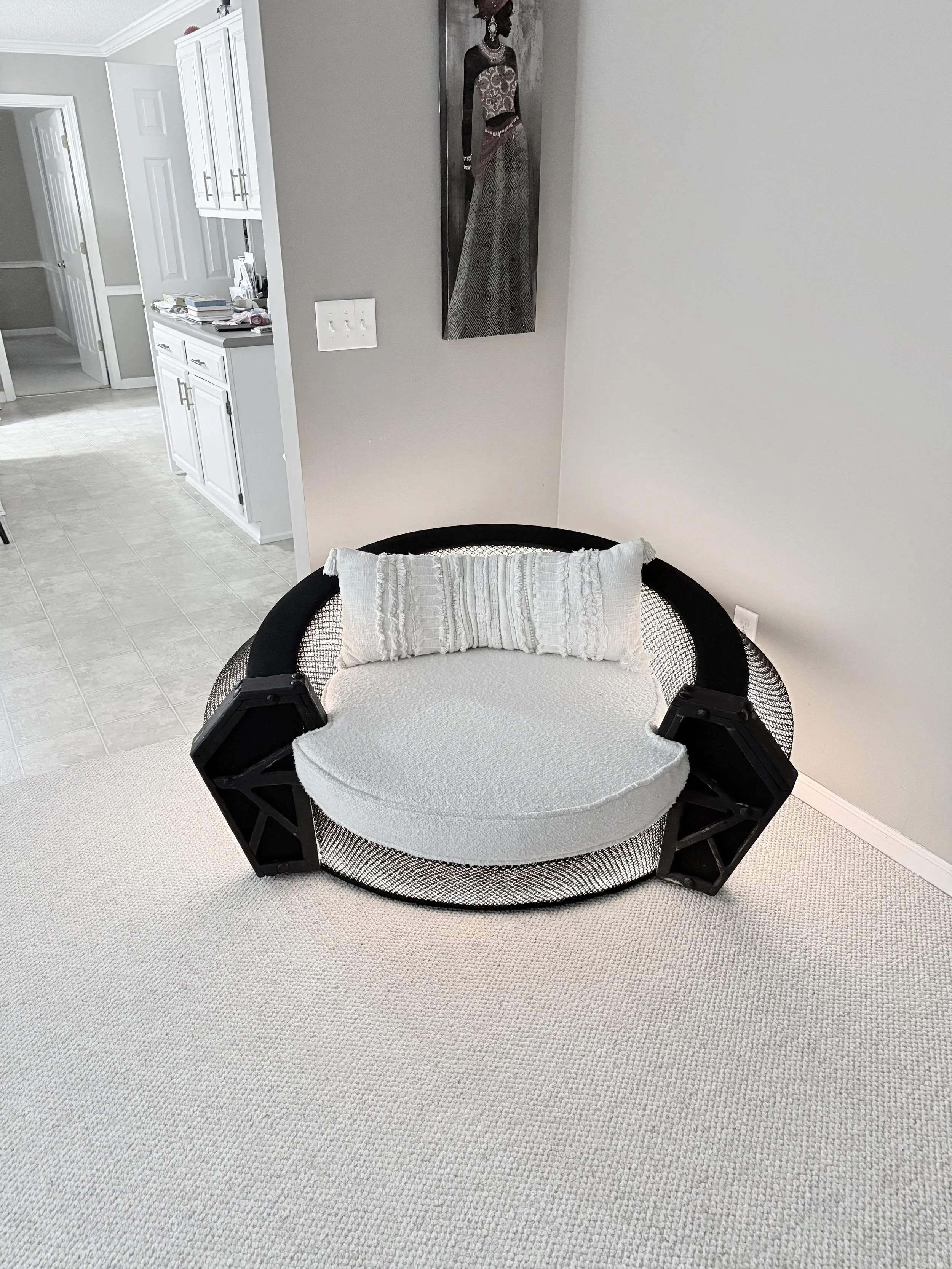 A black/white modern luxury armchair/sofa with lighting. 