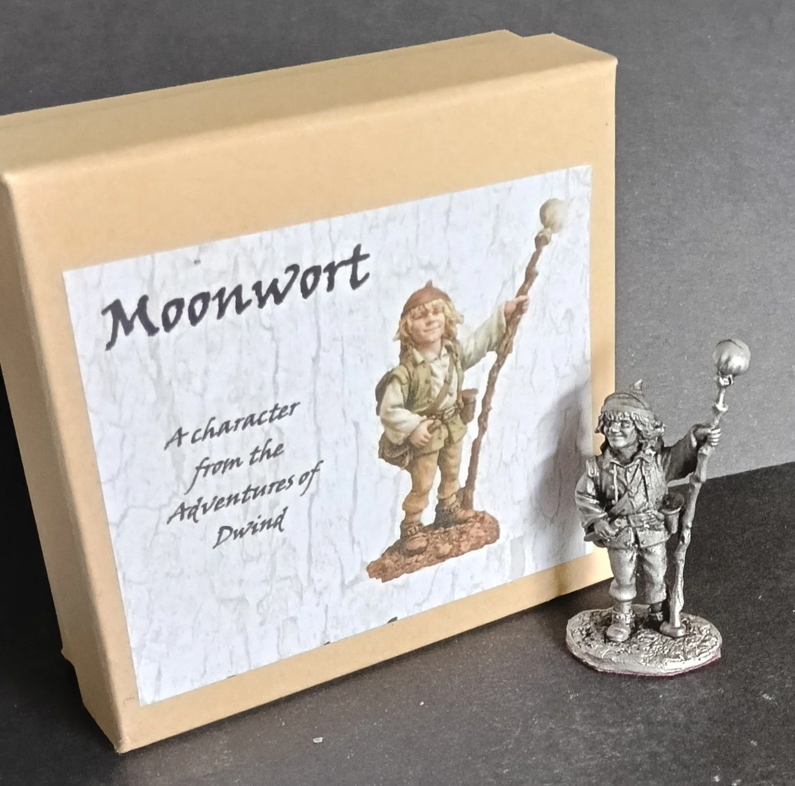 A collectible life size white metal figurine of Moonwort - the adventurer elf who is part of the rescue party in  the 'Adventures of Dwind', available as a kit or as an antiqued gift.