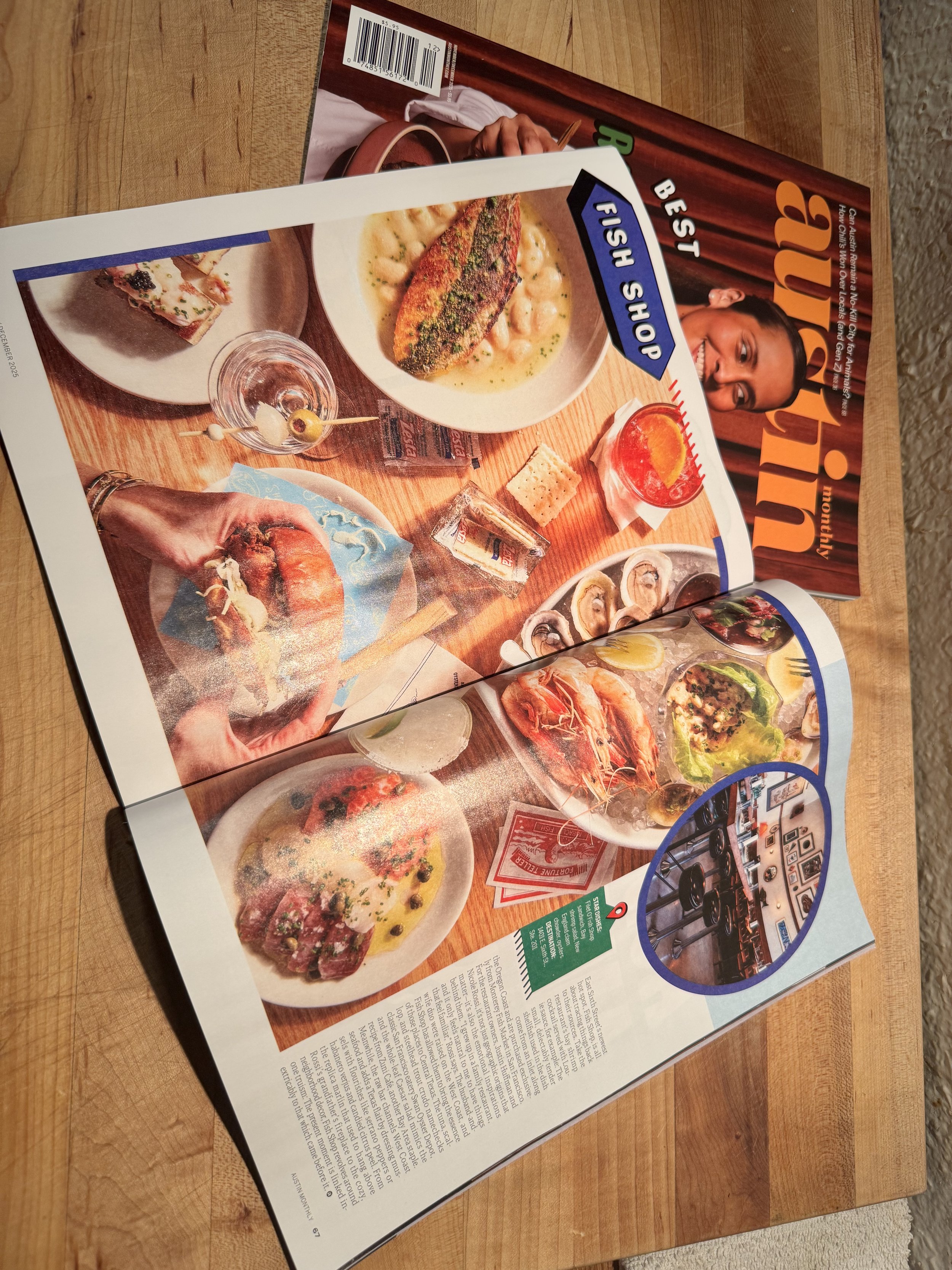 Open restaurant menu featuring various dishes including fish, steak, seafood, and appetizers, placed on a wooden table.