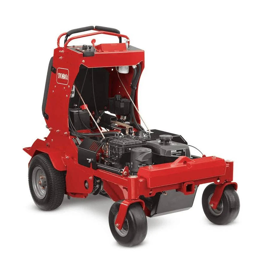 Red Toro ride-on lawn mower with exposed engine and large wheels.