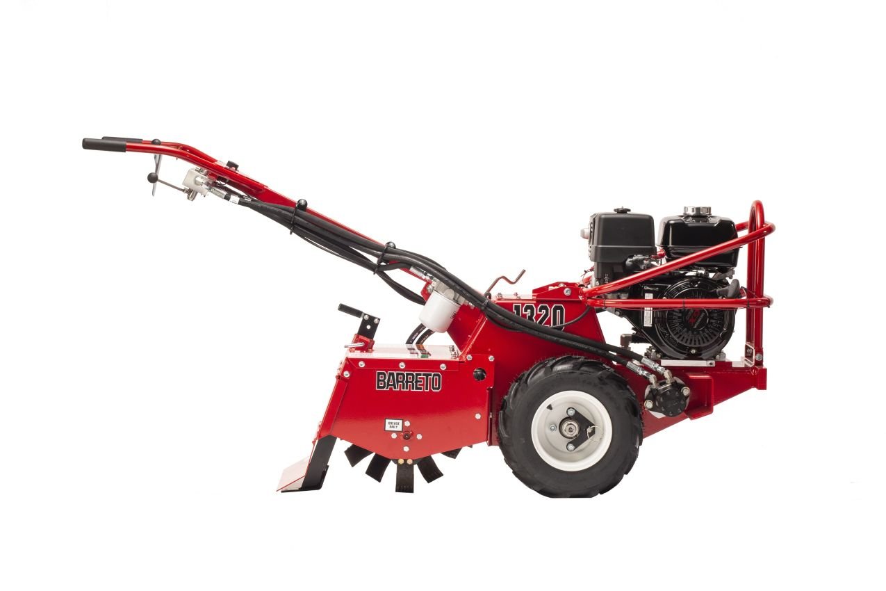 Red and black land clearing equipment with a large wheel, engine, and handlebar, branded Barreto.