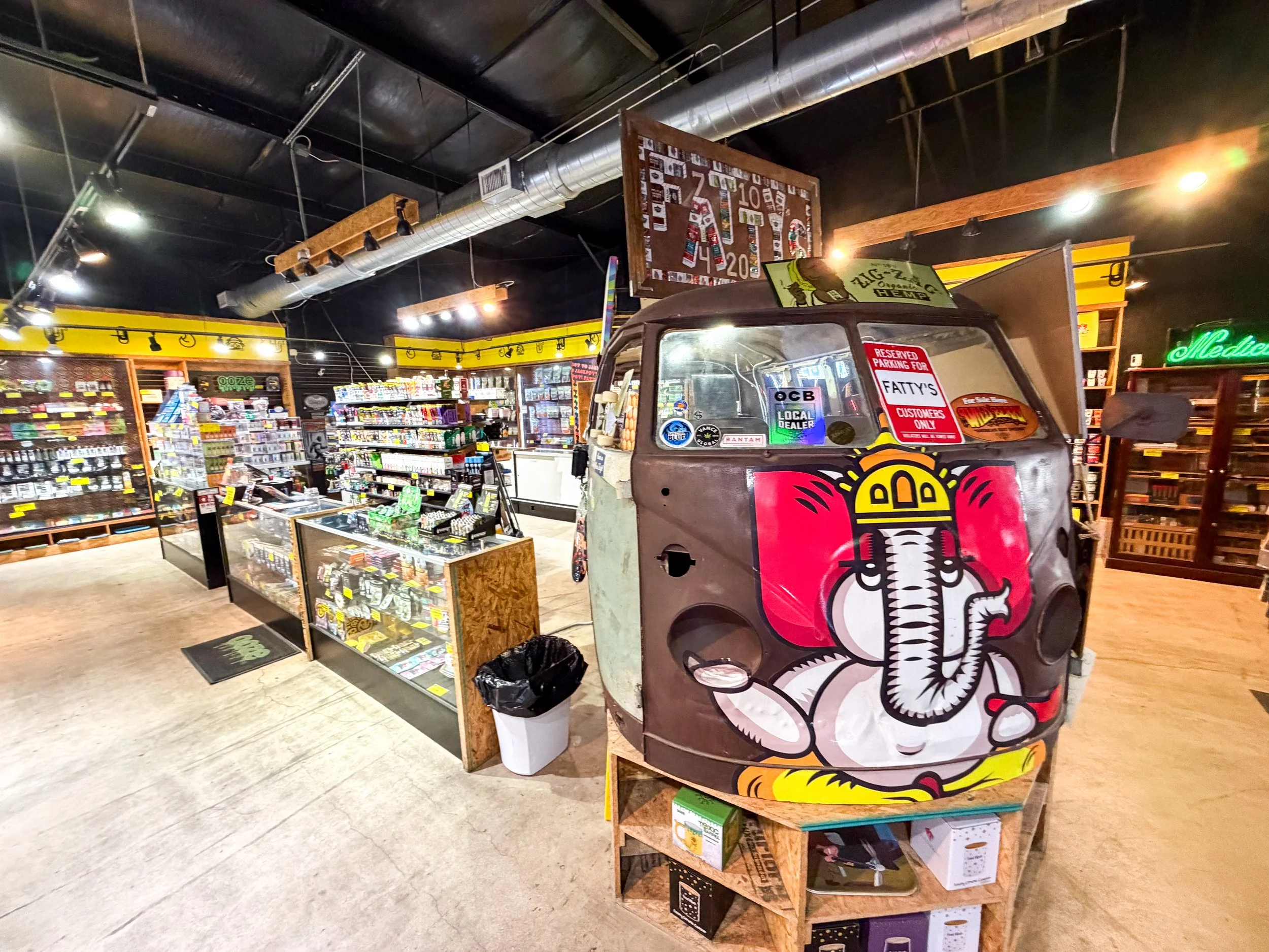Interior of the Fatty's Smoke Shop San Marcos location with the van artwork featuring the elephant logo.