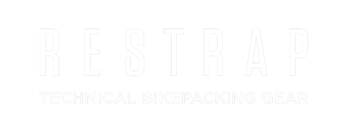 Restrap logo with the tagline 'Technical Bikepacking Gear' in white on a black background.