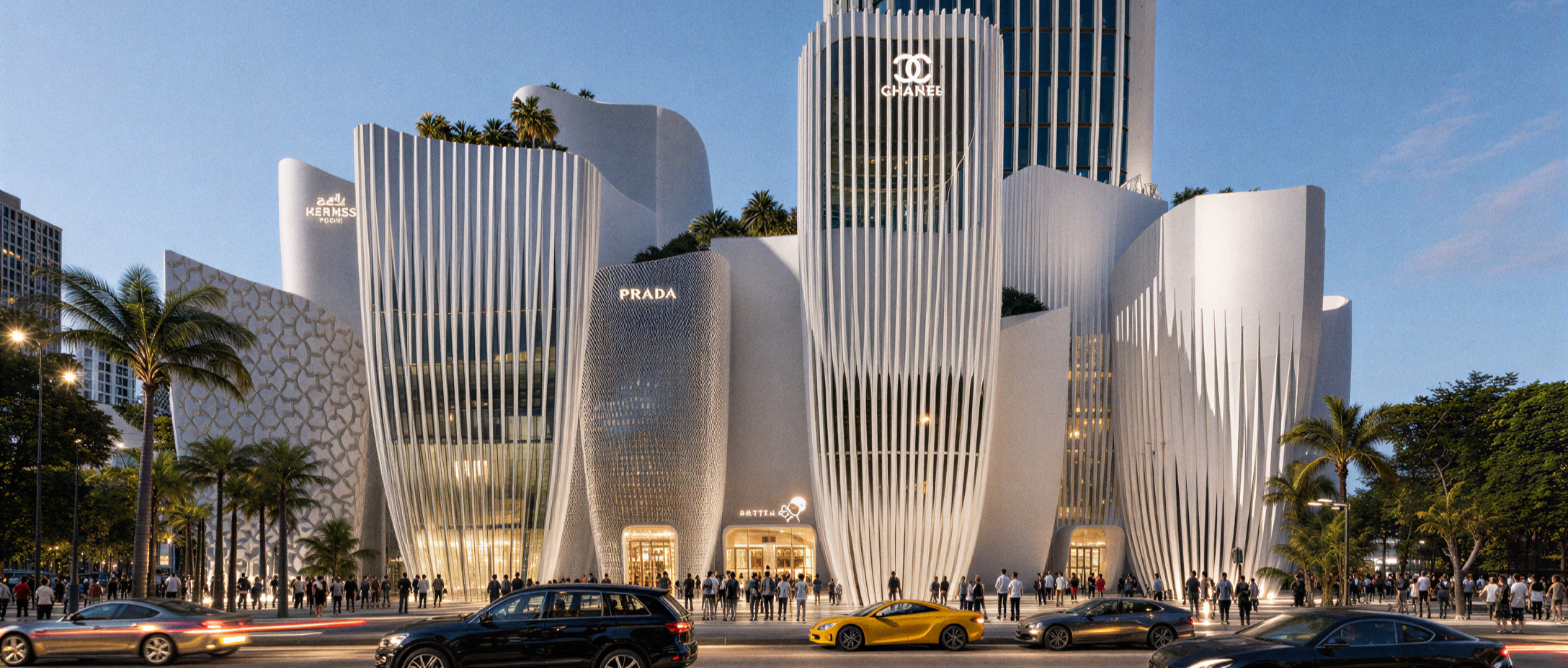 A modern white building with curved, vertical slats, featuring luxury brand signs like Chanel, Prada, and KERMS. People are outside on the sidewalk, and several cars are parked or moving in front of the building during dusk.