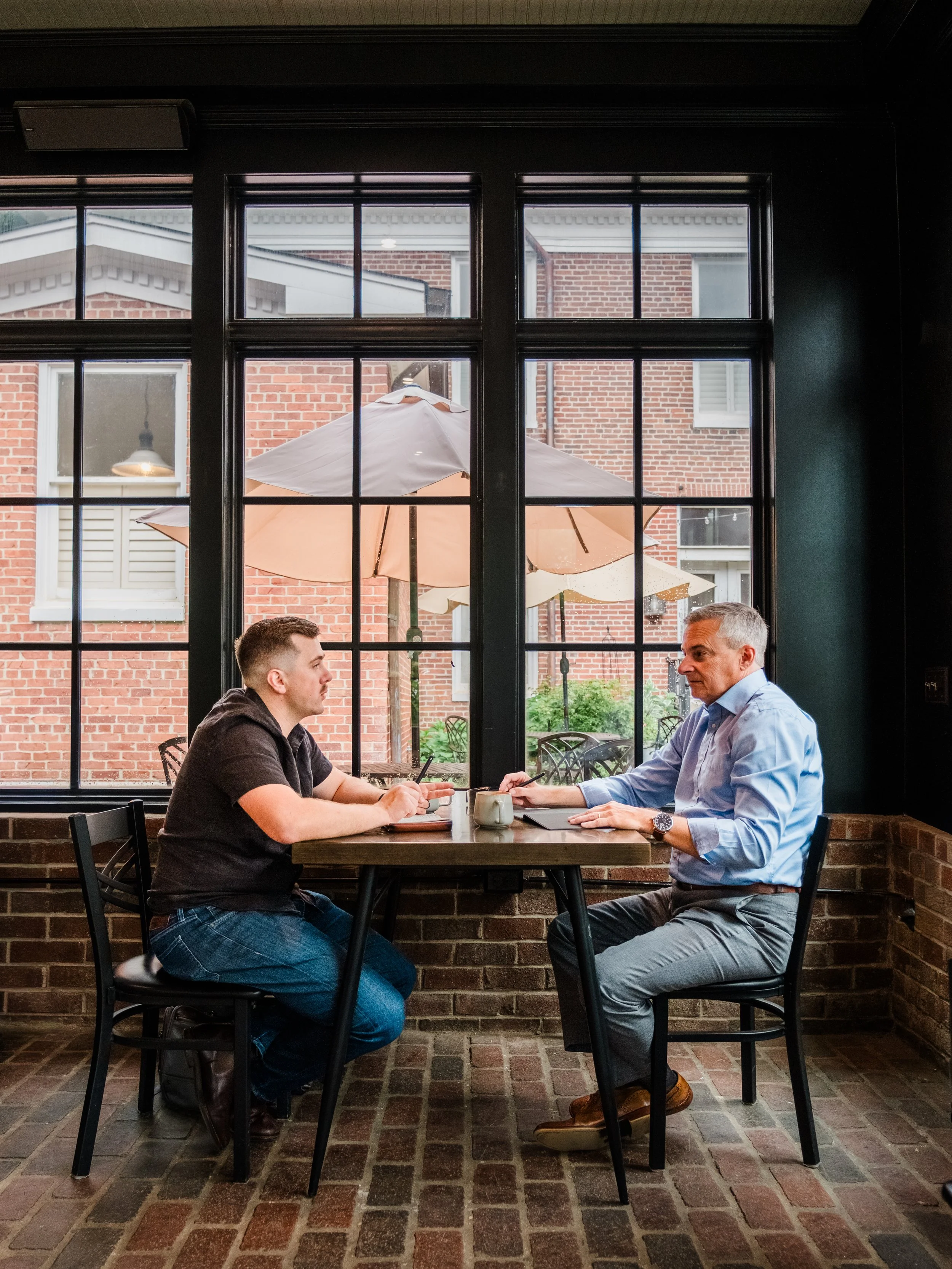 Executive coach Jeff Fry meeting with a client to discuss leadership and career development.